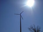 Wind turbine in sunlight photograph