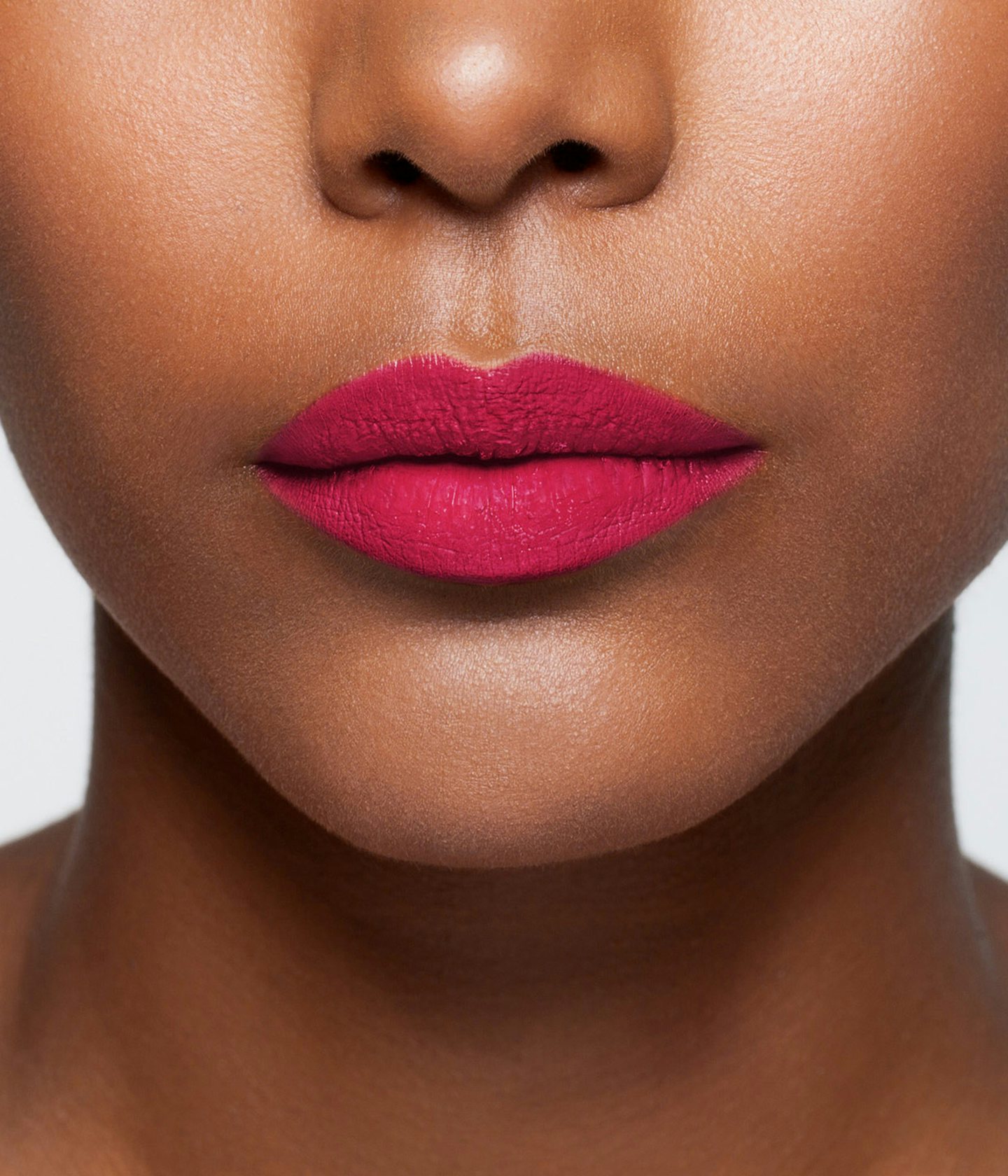 La bouche rouge Princess Pink lipstick shade on the lips of a dark skin model