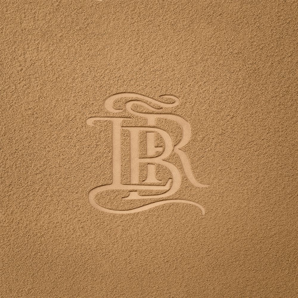 La bouche rouge La Terre Blonde bronzer swatch with logo