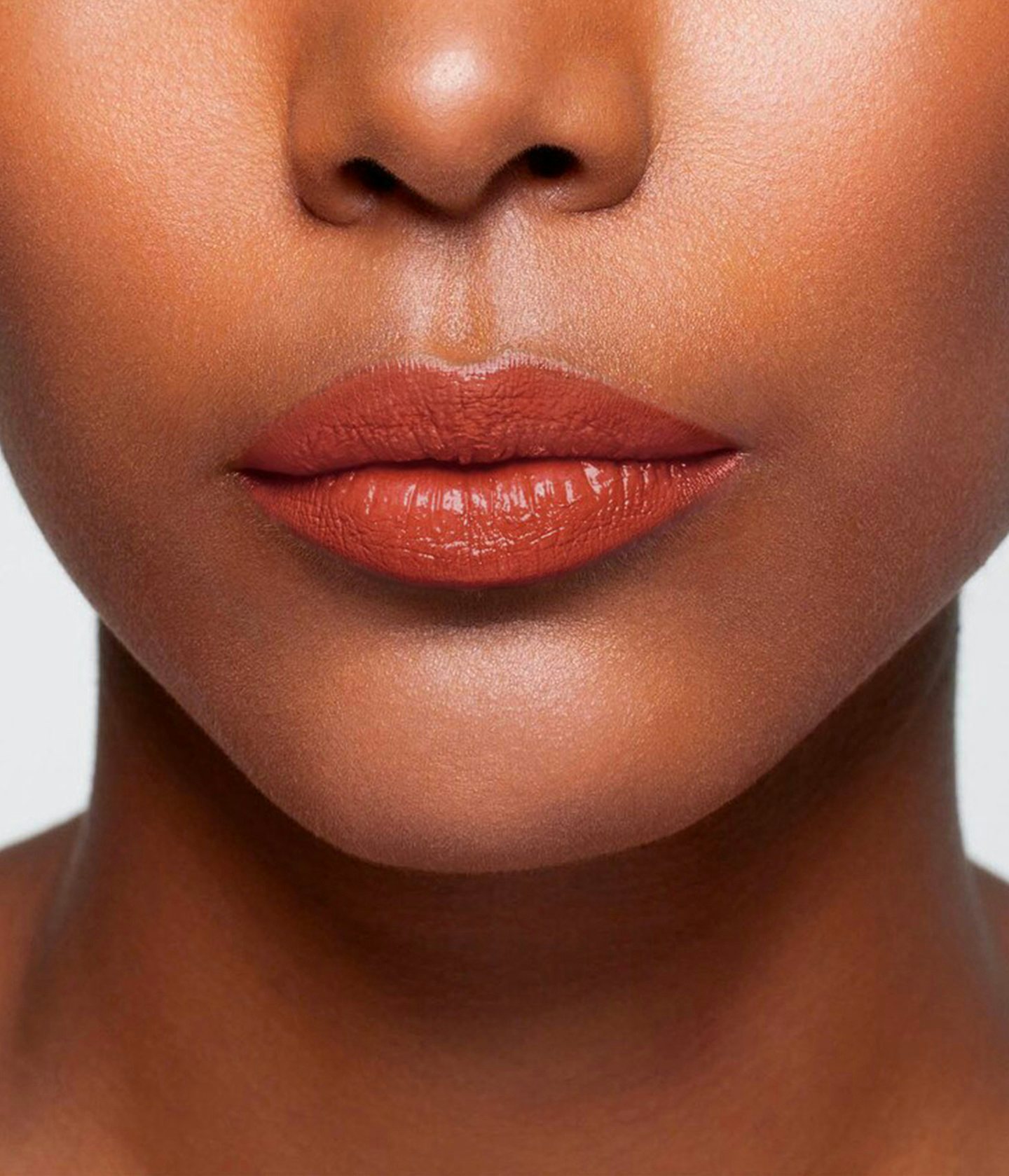 La bouche rouge The Koto balm shade on the lips of a dark skin model