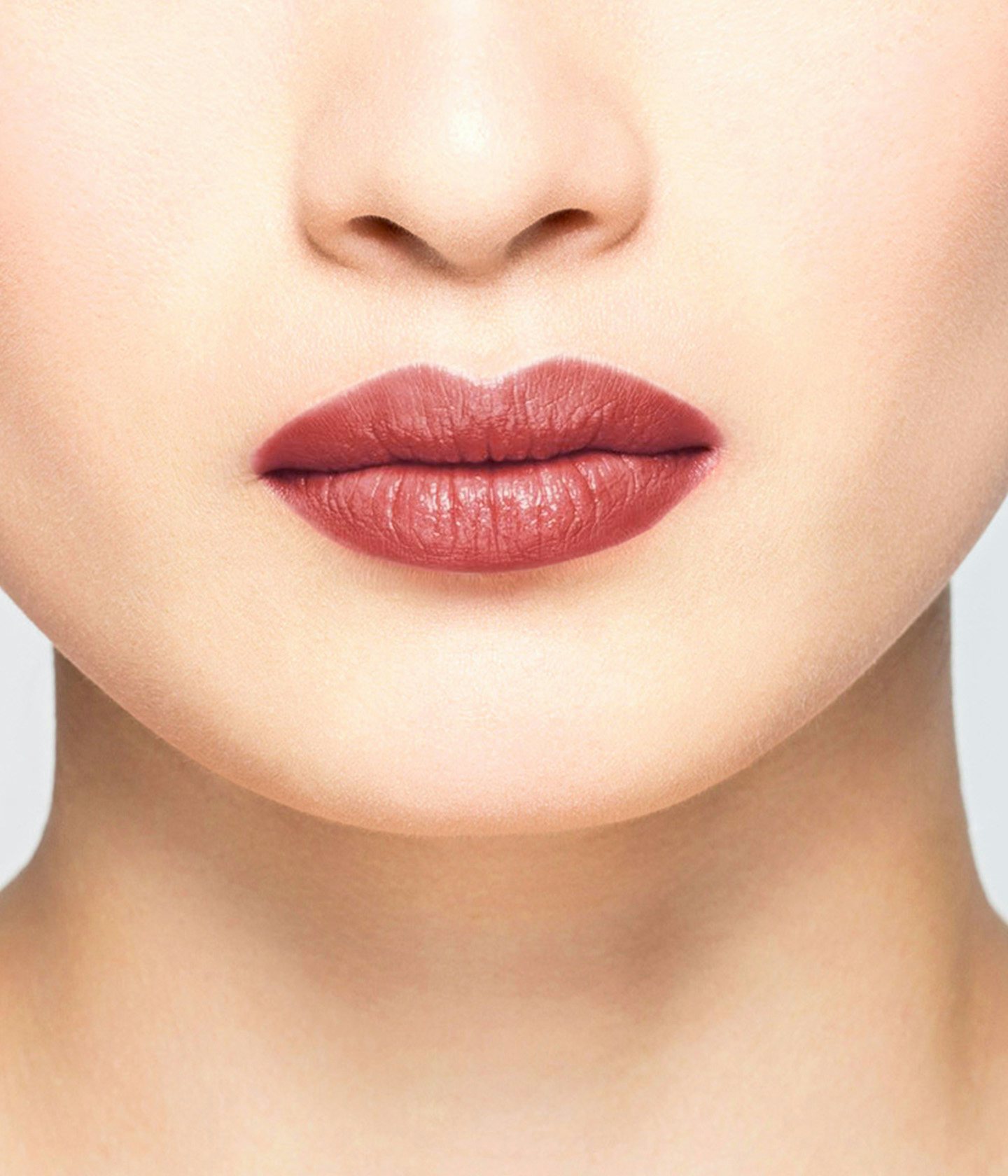 La bouche rouge Le Rose Lovisa lipstick shade on the lips of an Asian model