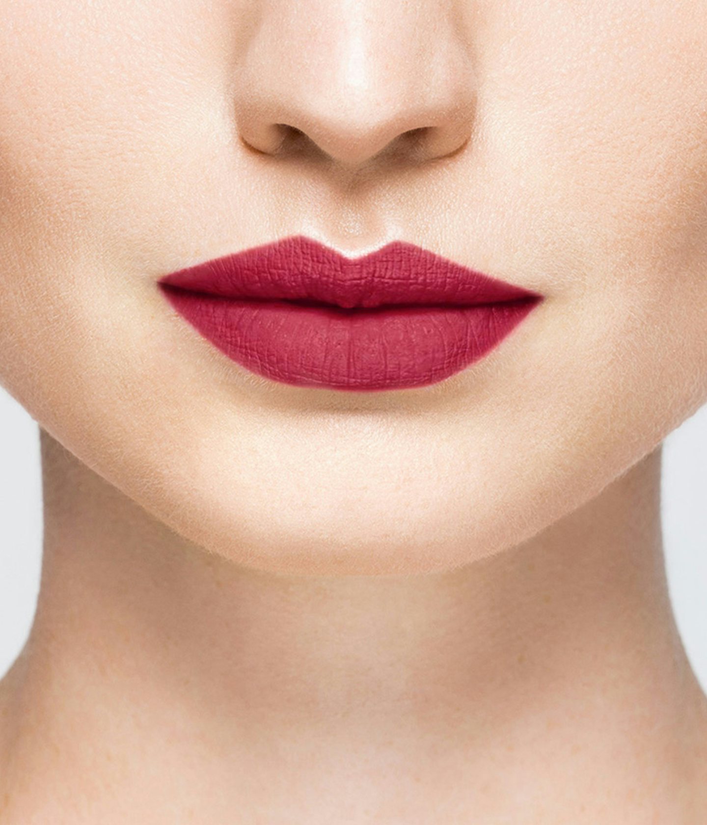 La bouche rouge Burgundy lipstick shade on the lips of a fair skin model