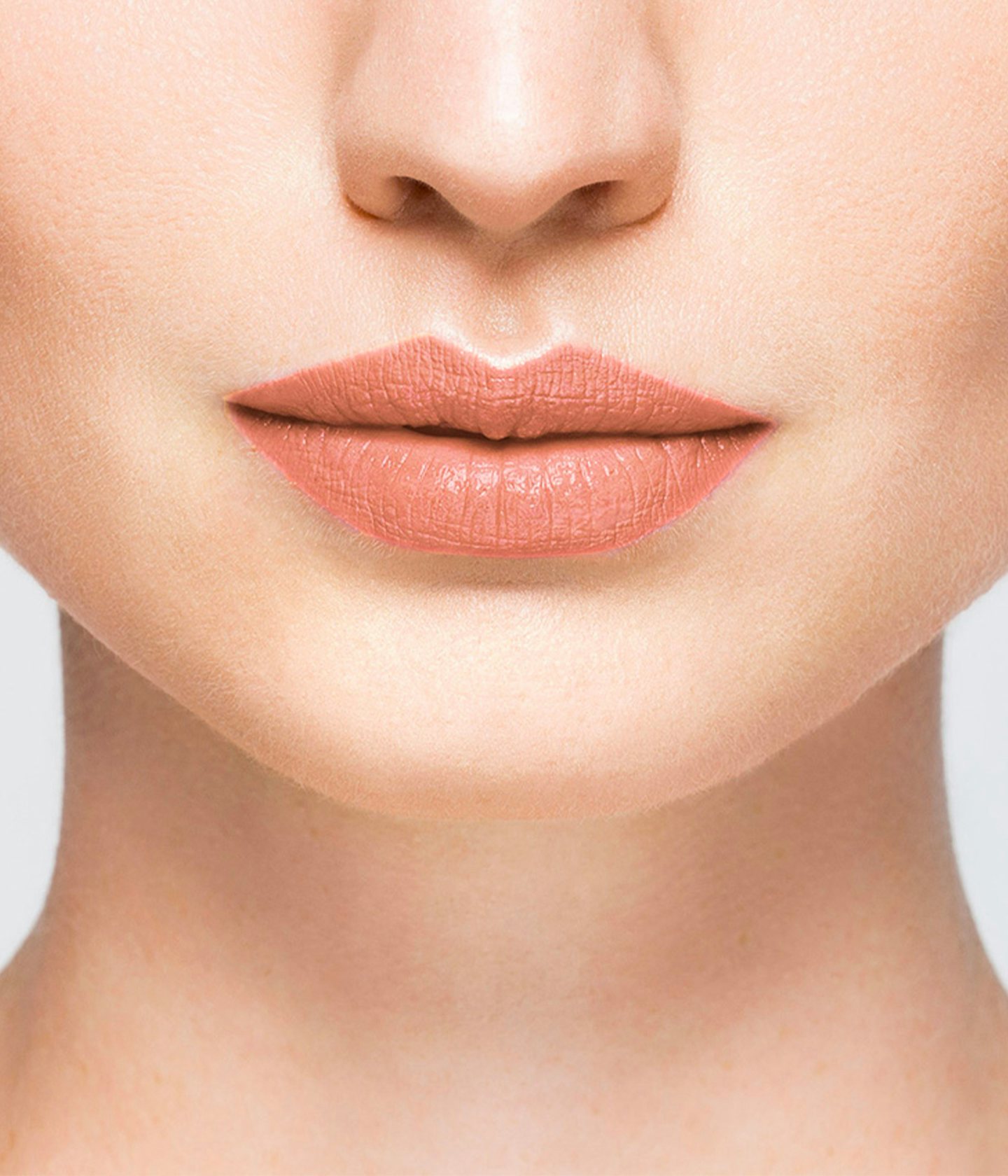 La bouche rouge Le Nude Elsa lipstick shade on the lips of a fair skin model