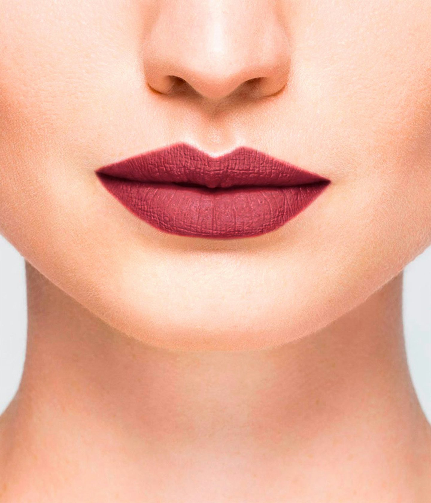 La bouche rouge Le Rose Tuileries lipstick shade on the lips of a fair skin model