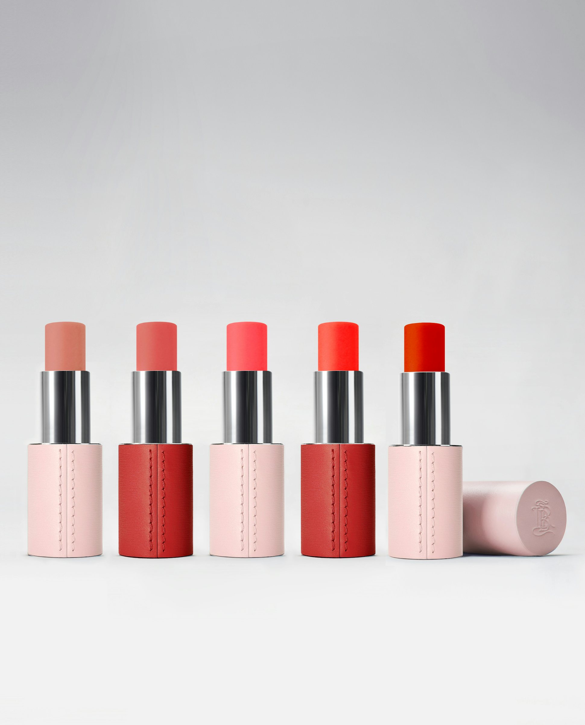 La bouche rouge Blush Sticks in their pink and red leather cases