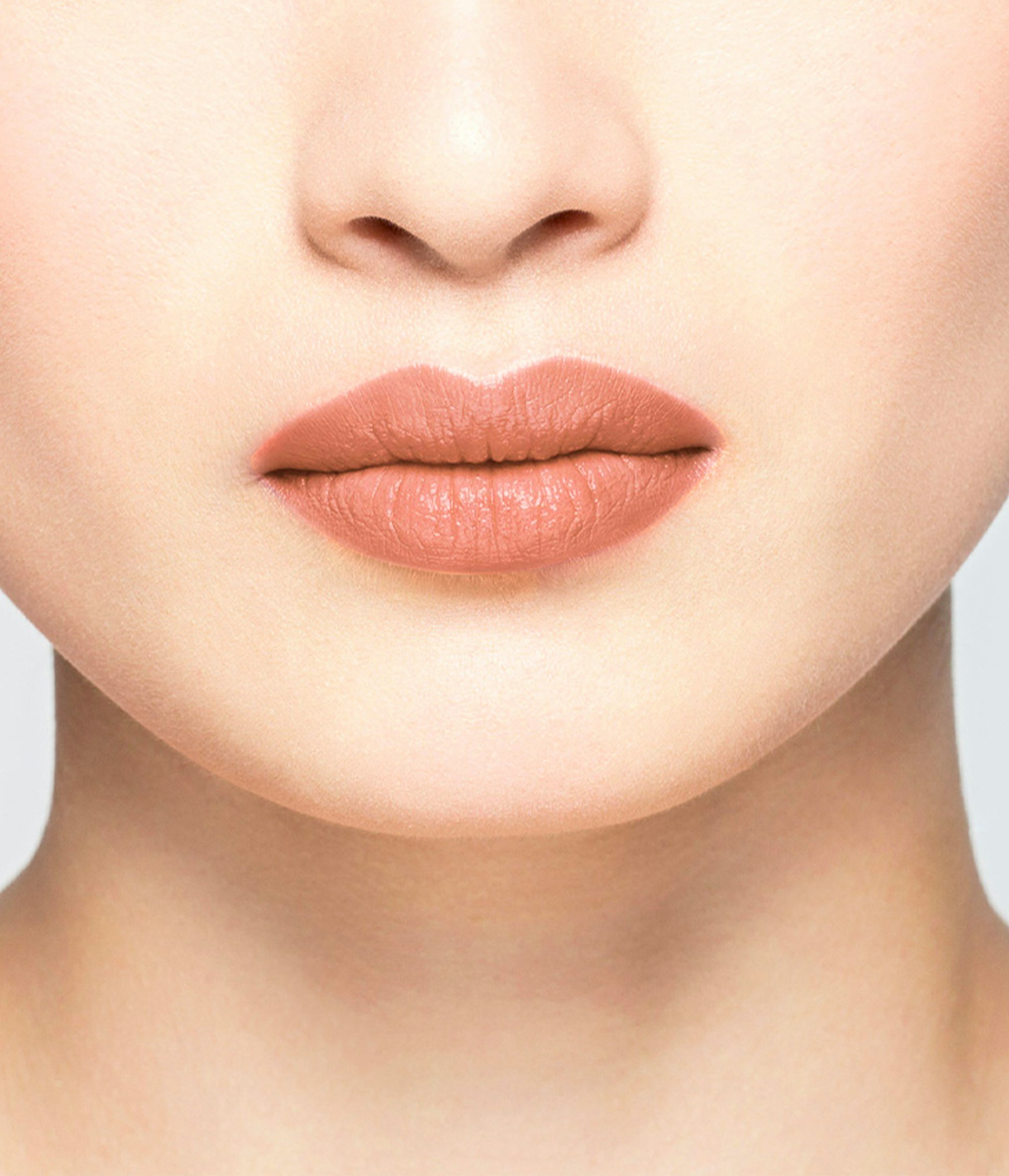 La bouche rouge Le Nude Elsa lipstick shade on the lips of an Asian model