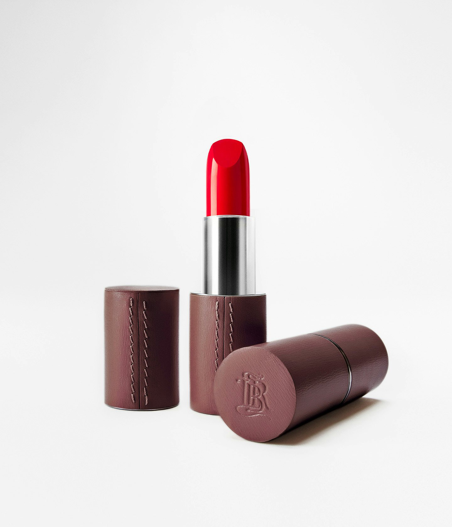 La bouche rouge upcycled fine leather case in Chocolate with La bouche rouge 21 Satin lipstick shade