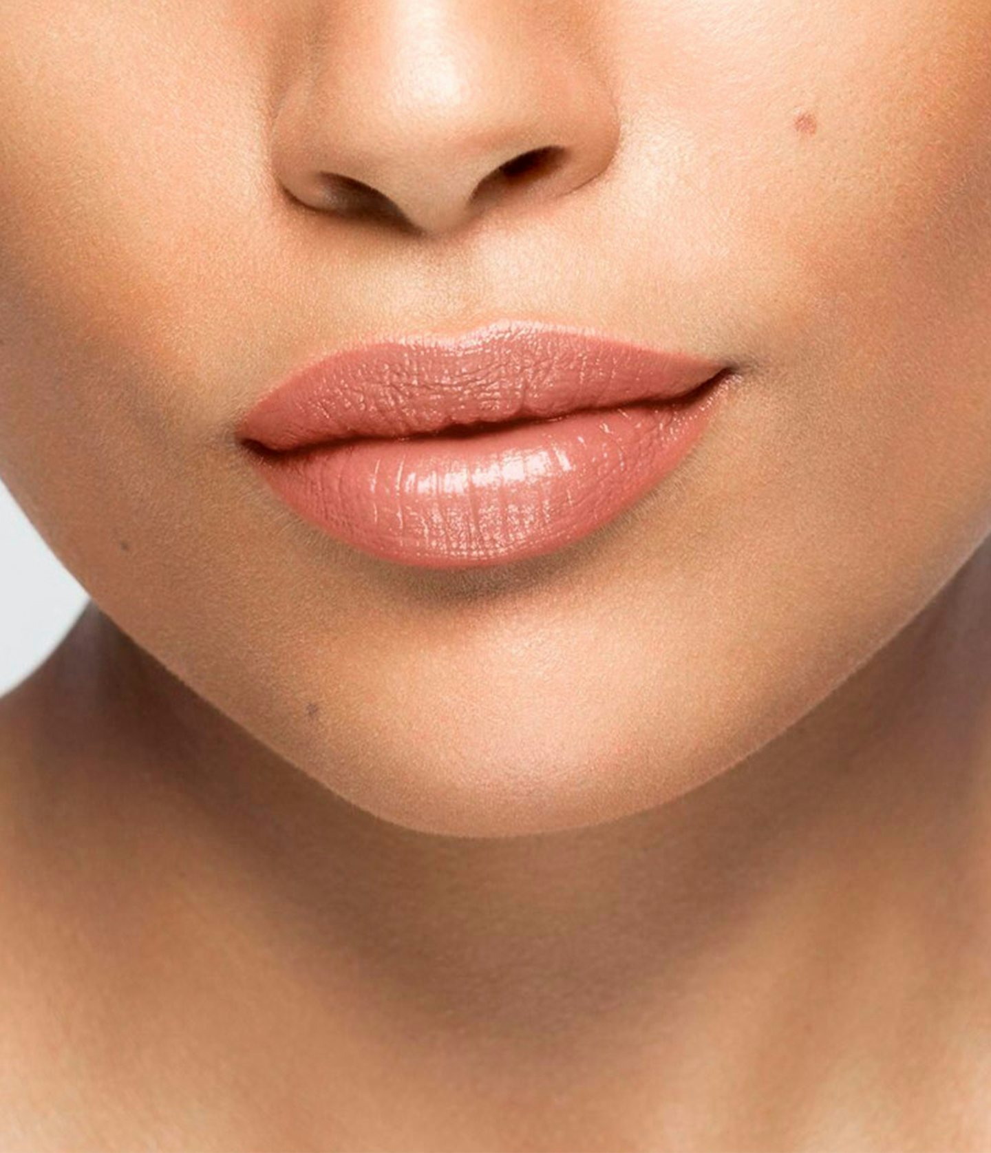 La bouche rouge Peach balm lipstick shade on the lips of a medium skin model