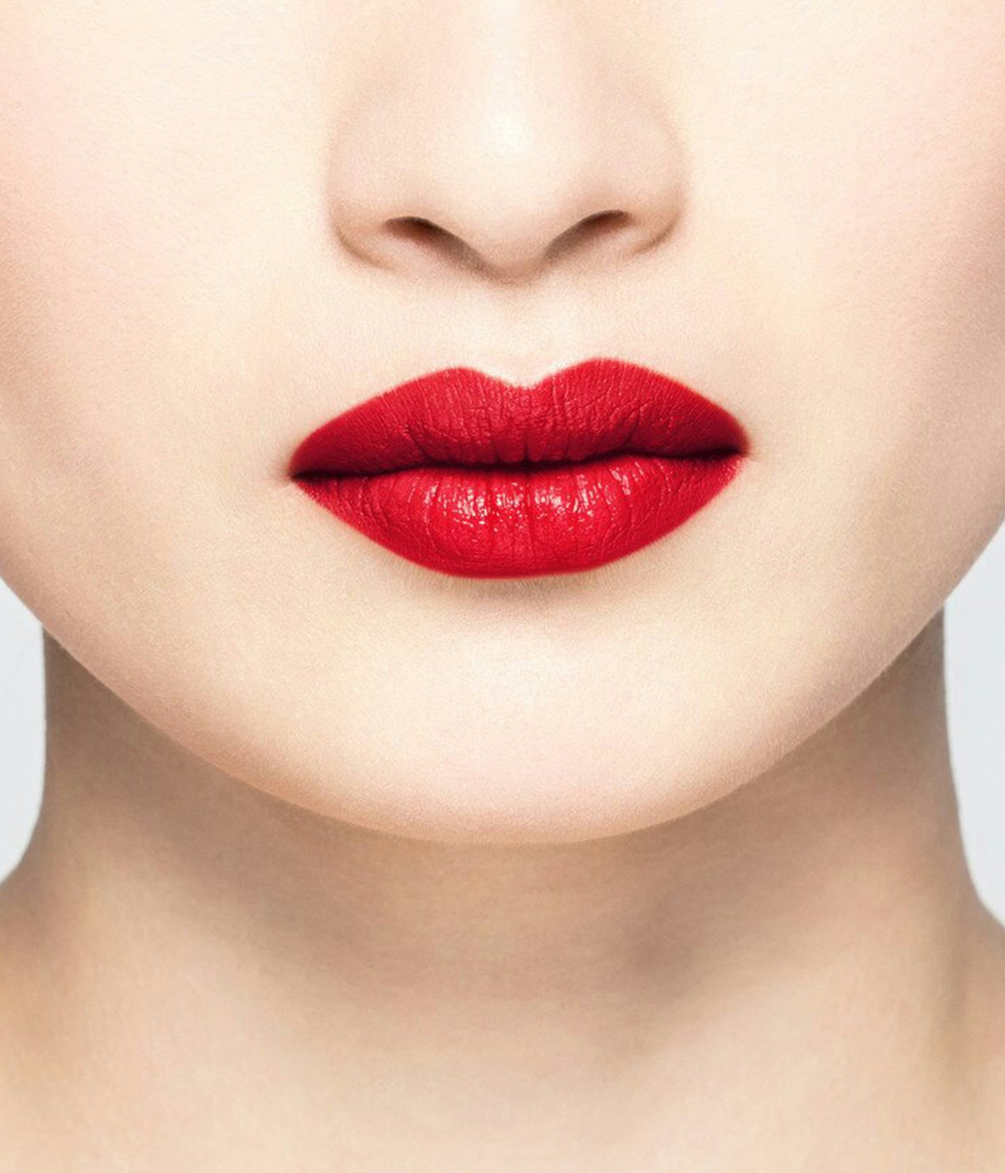 La bouche rouge Le Rouge Self Service Satin lipstick shade on the lips of an Asian model