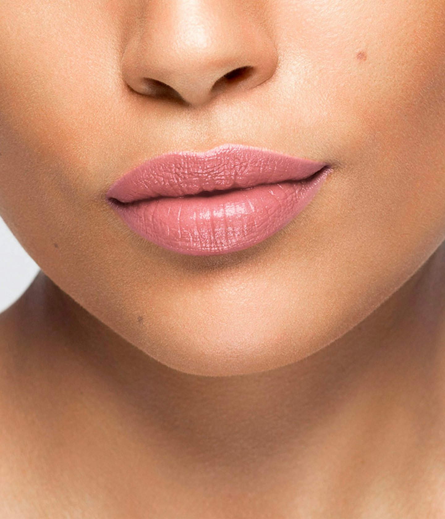 La bouche rouge The Aime lipstick shade on the lips of an medium skin model