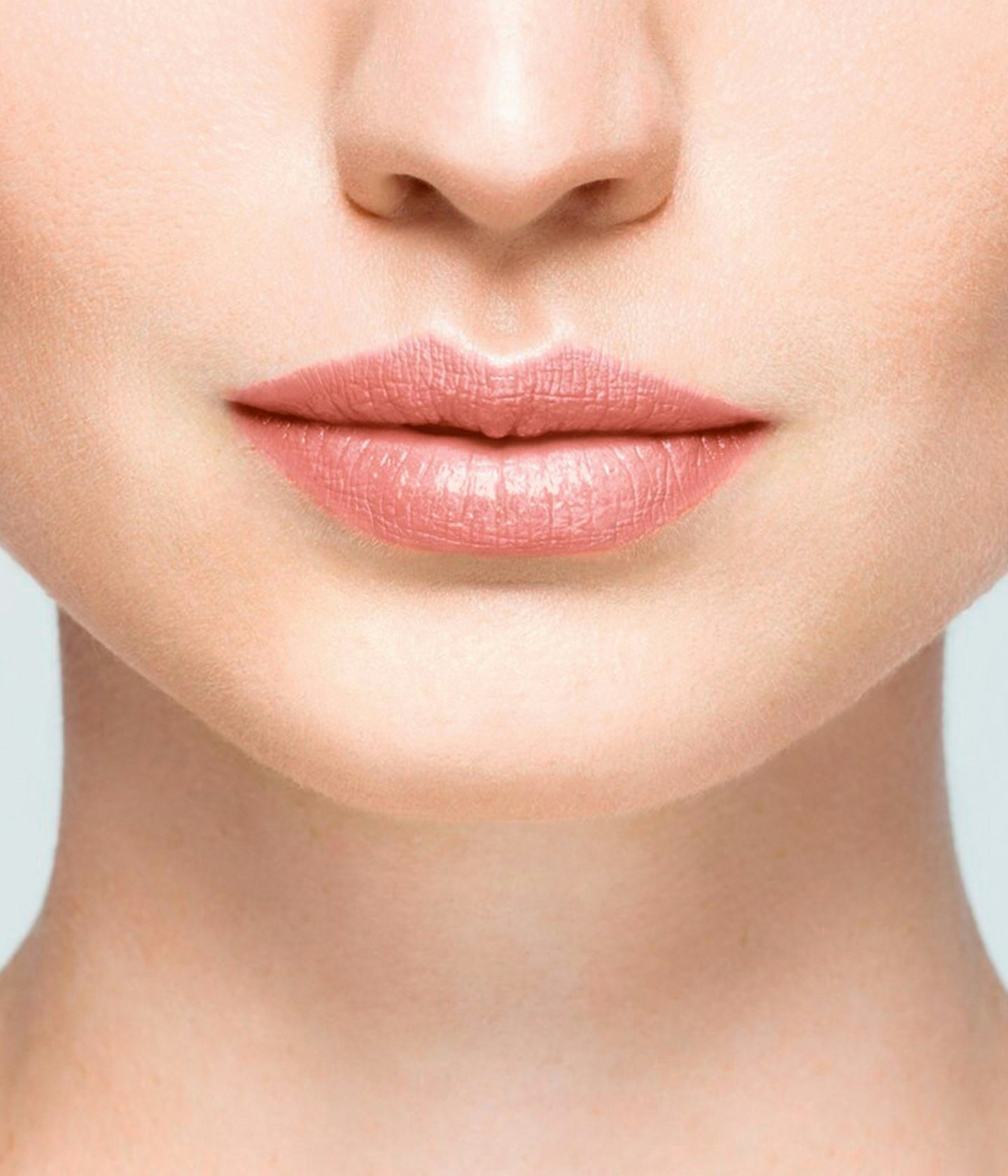 La bouche rouge White balm lipstick shade on the lips of a fair skin model