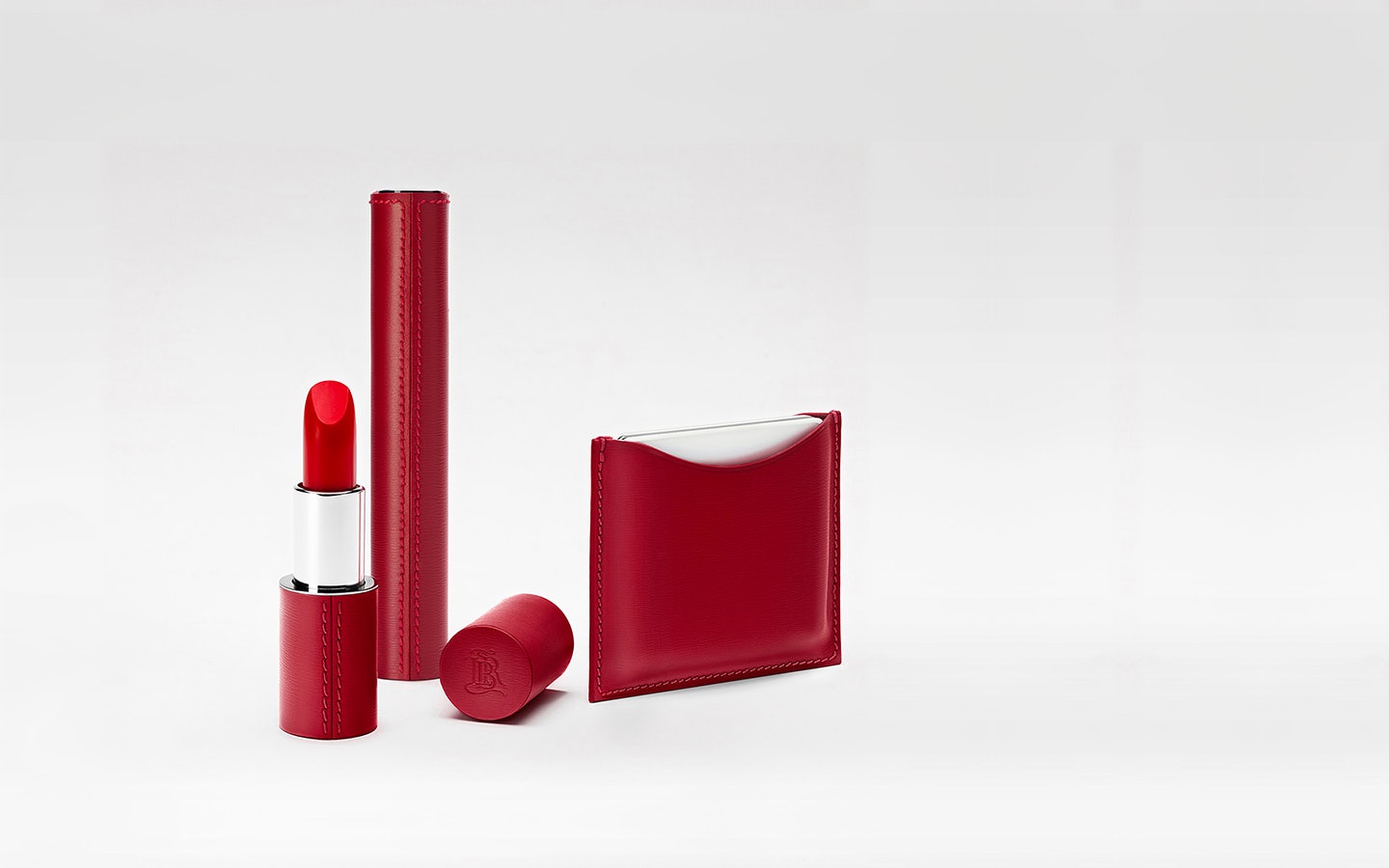 La bouche rouge red leather family with the red lipstick case, compact case and sleeve