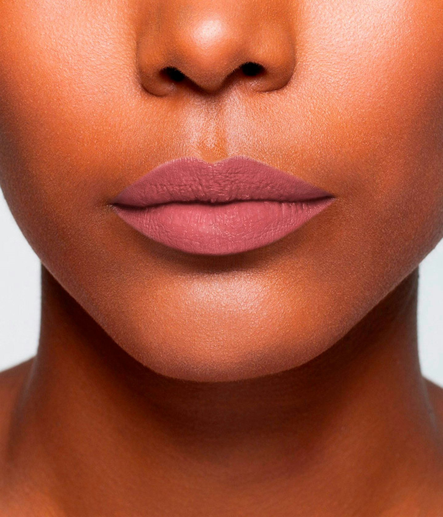 La bouche rouge Le Rose Saint Germain lipstick shade on the lips of a dark skin model
