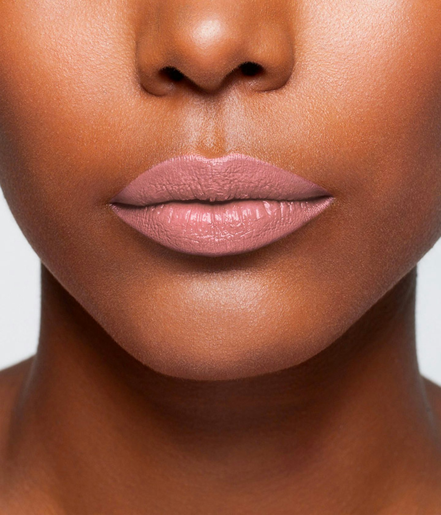 La bouche rouge The Aime lipstick shade on the lips of a dark skin model