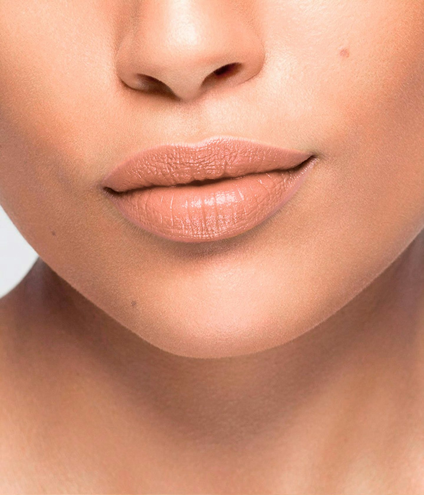 La bouche rouge Le Nude Veronika lipstick shade on the lips of an medium skin model