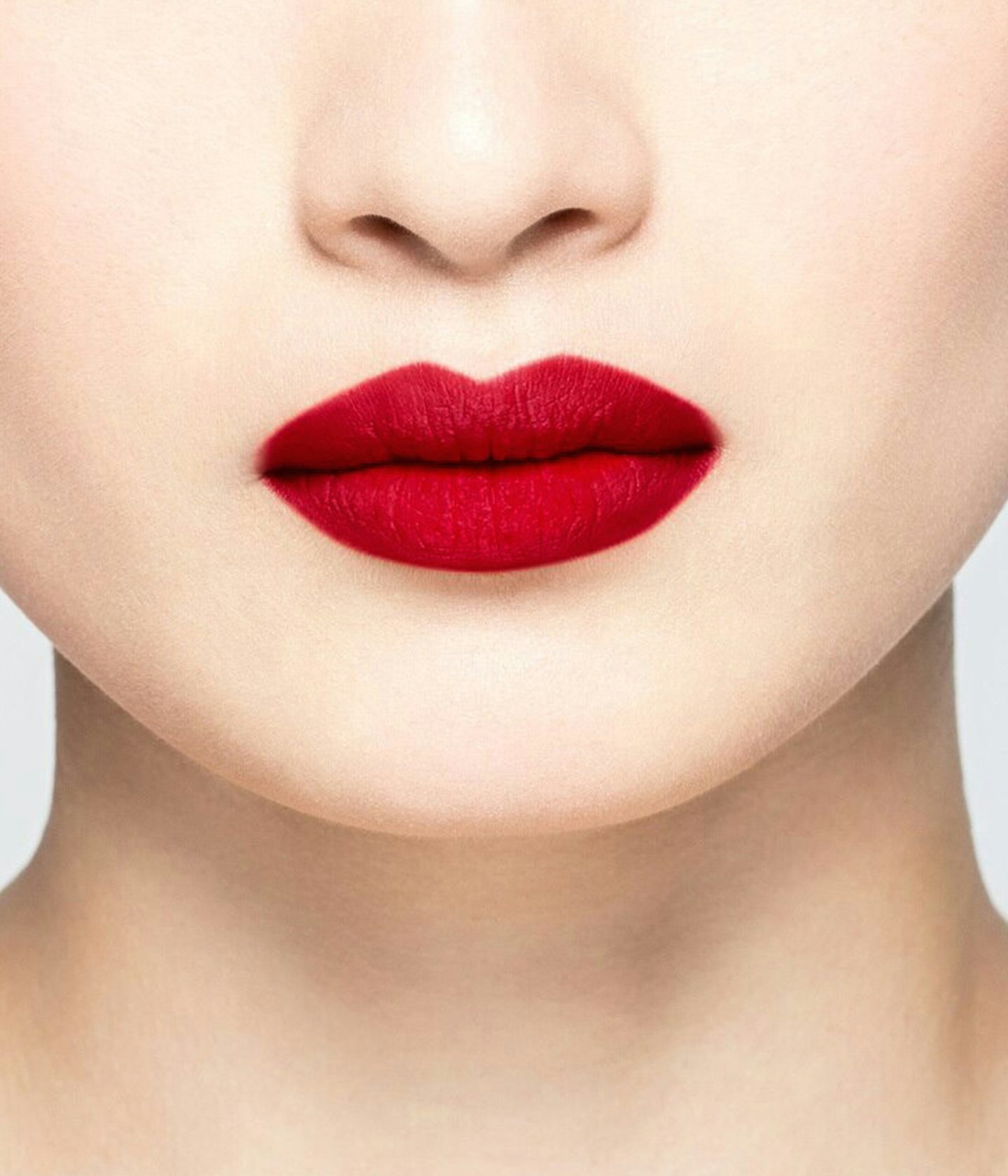 La bouche rouge Le Rouge Rosie lipstick shade on the lips of an Asian model