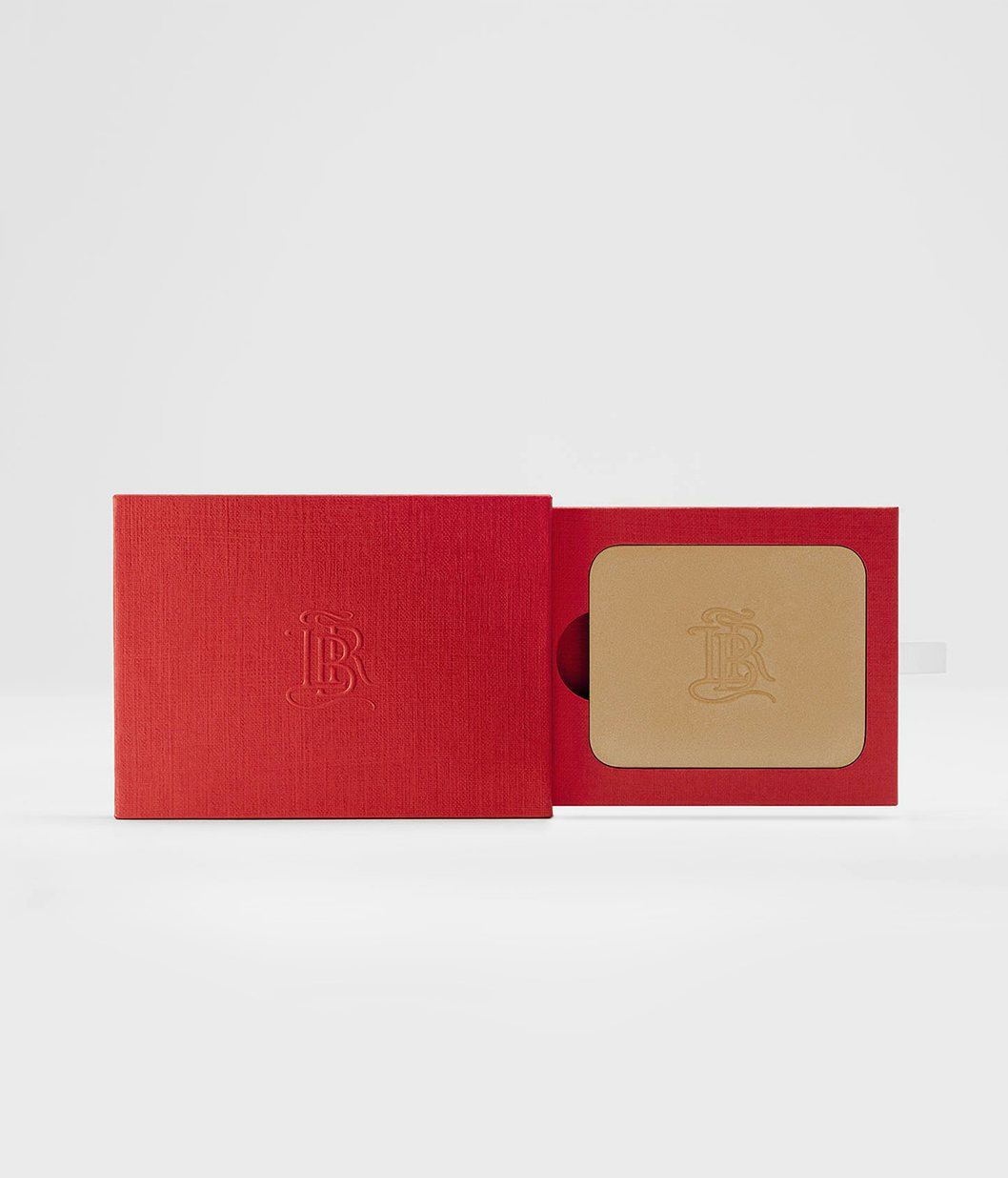 La bouche rouge La Terre Blonde bronzer in the red paper case