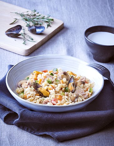 Seafood and tuna risotto with baby vegetables
