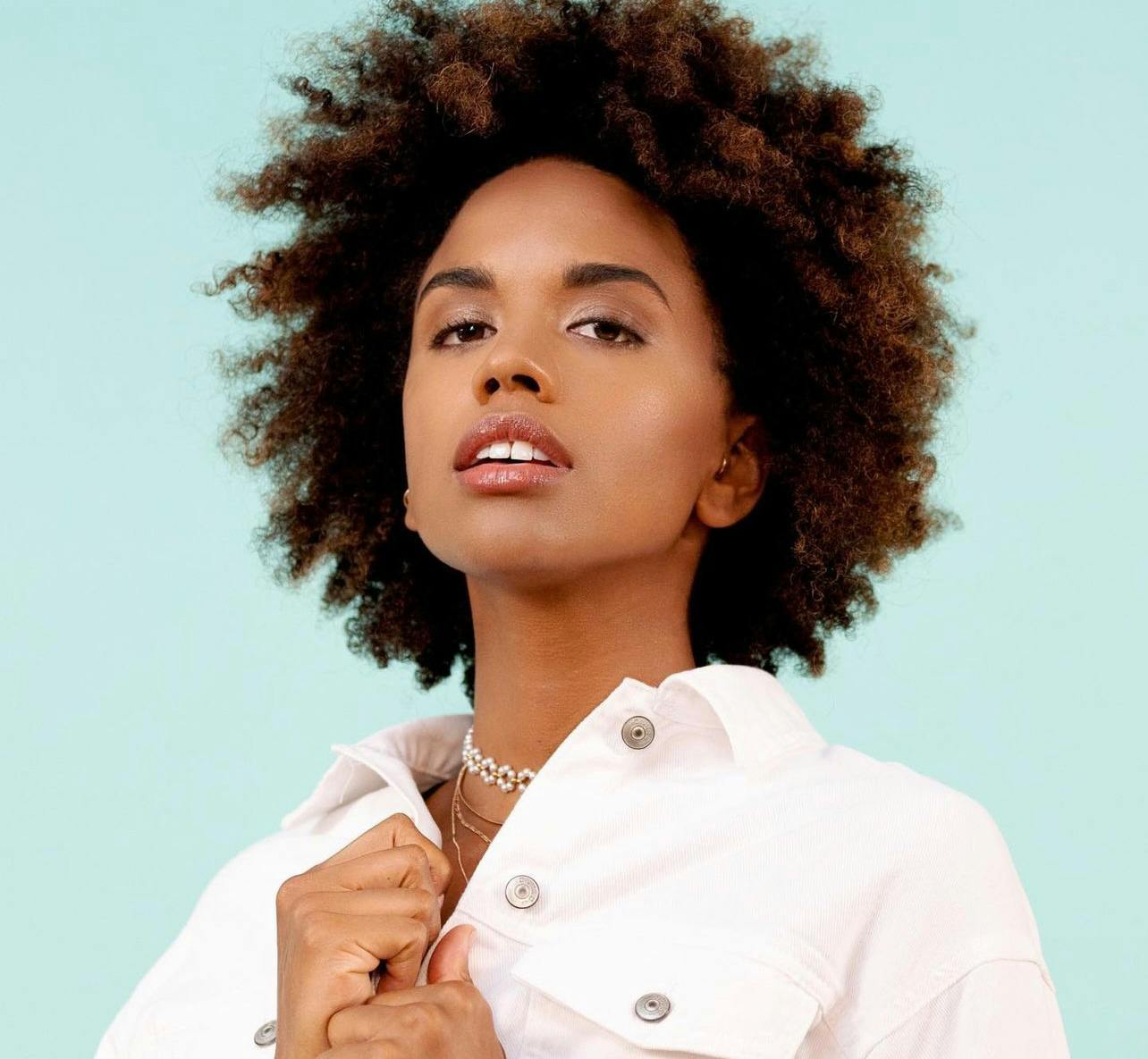 Fashionable black woman in white shirt