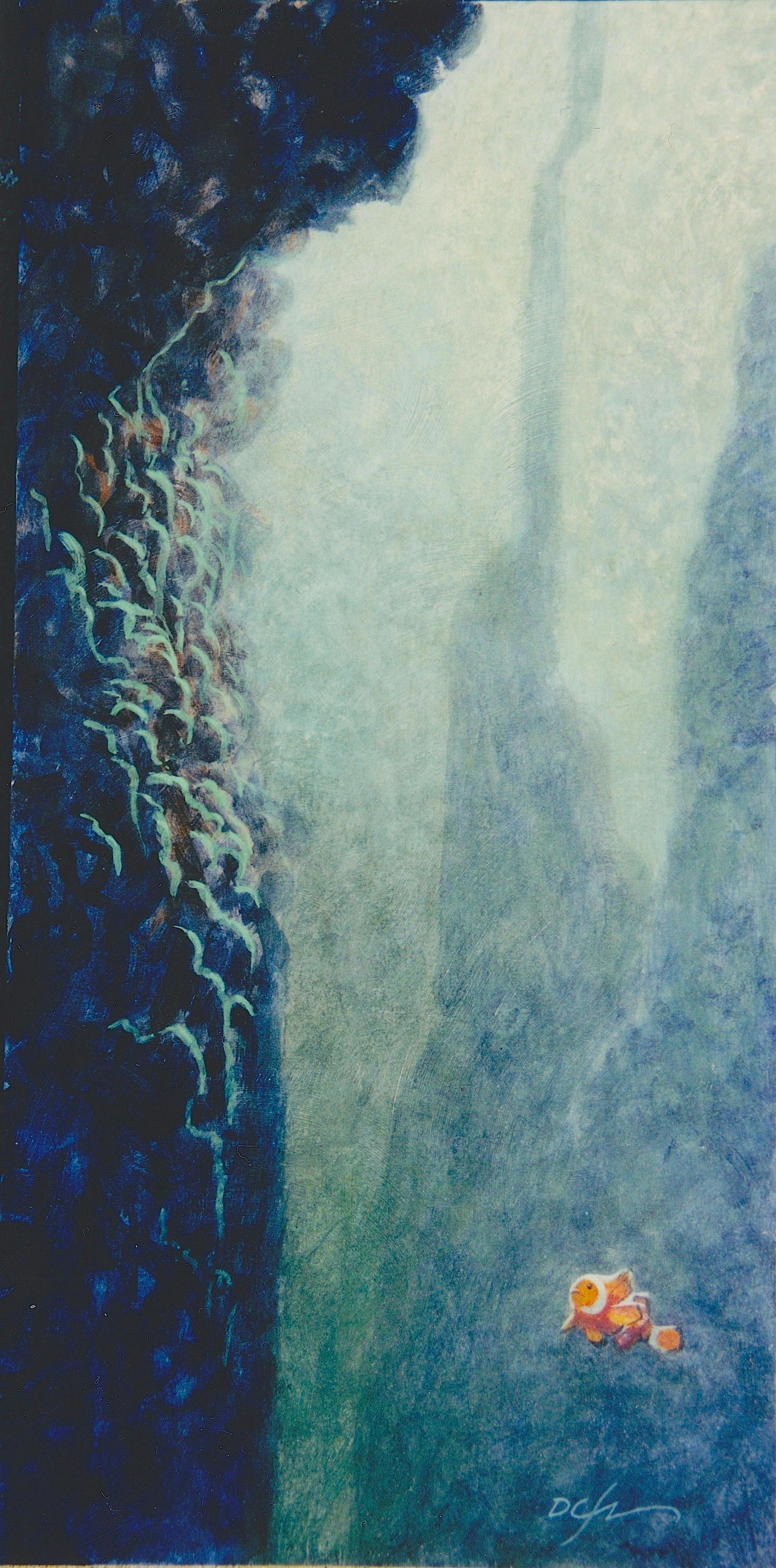 A clownfish looking up at a tall reef