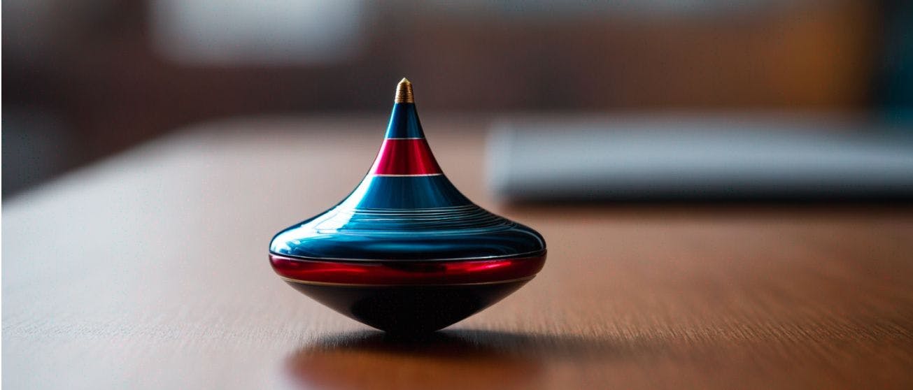 A blue and red spinning top positioned on a desk. The dynamic motion of the toy exemplifies the intricate and balanced processes involved in 'how generative AI works', representing movement, precision, and innovation.