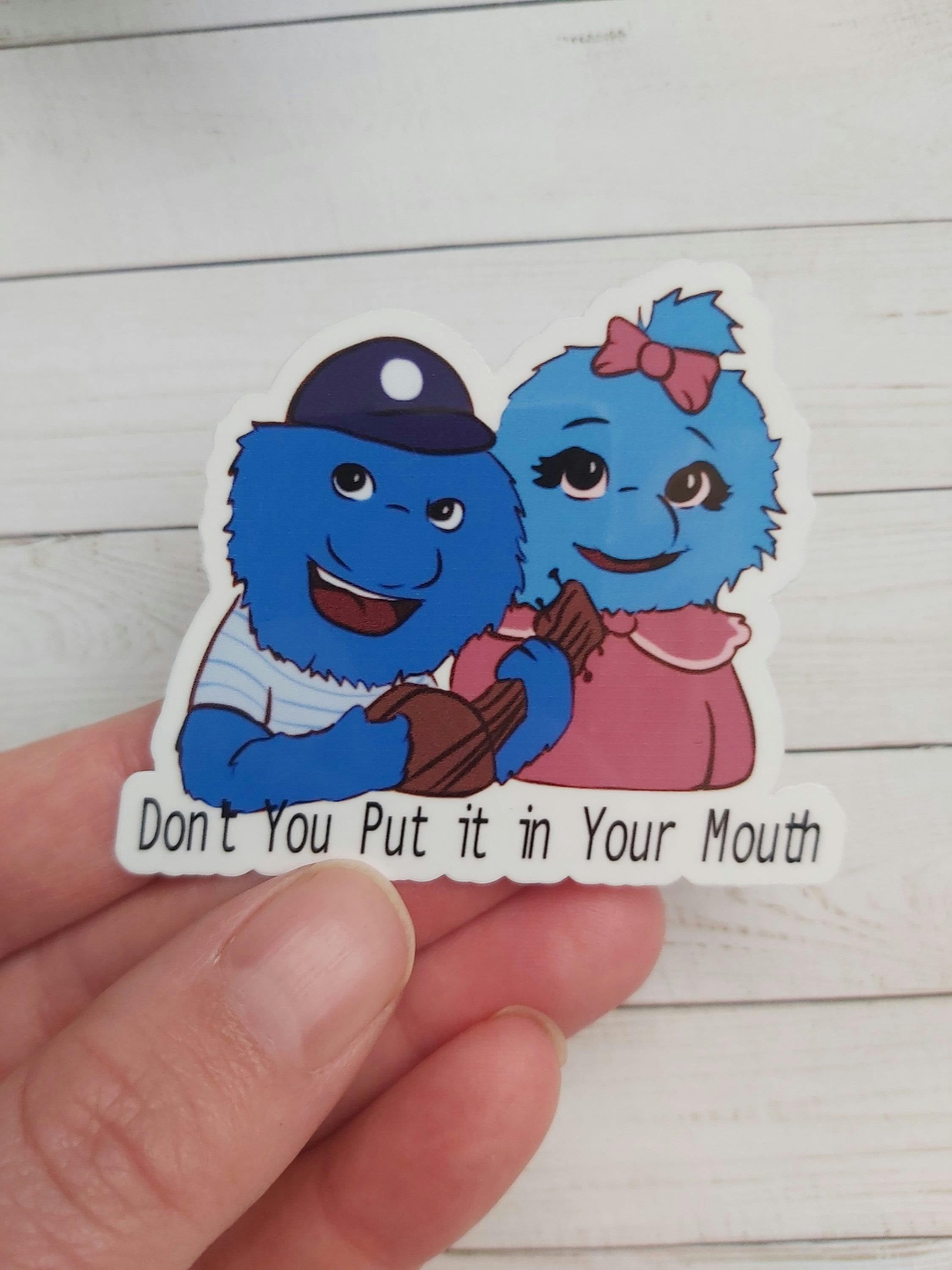 A sticker of two blue monsters