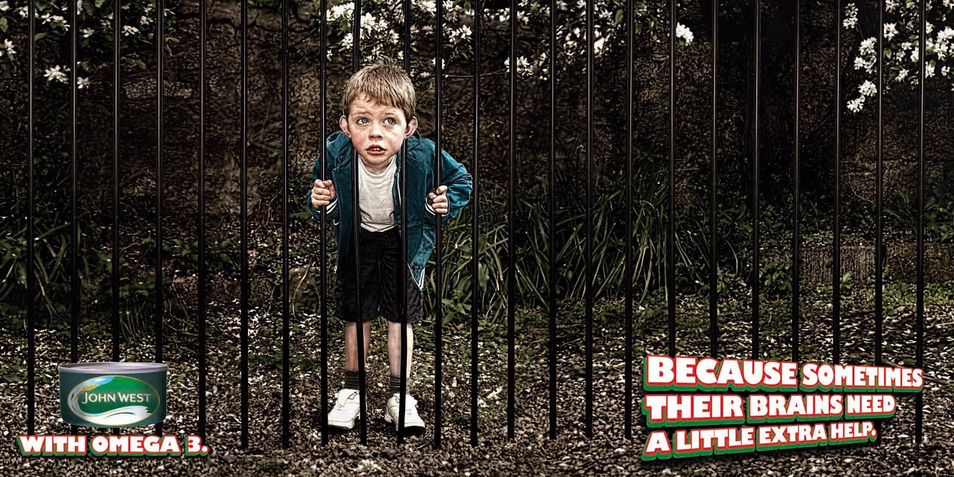 John West ad with child behind iron fence