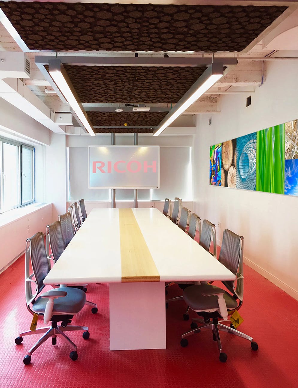 Modern conference room with projector setup for a meeting on business presentation topics.