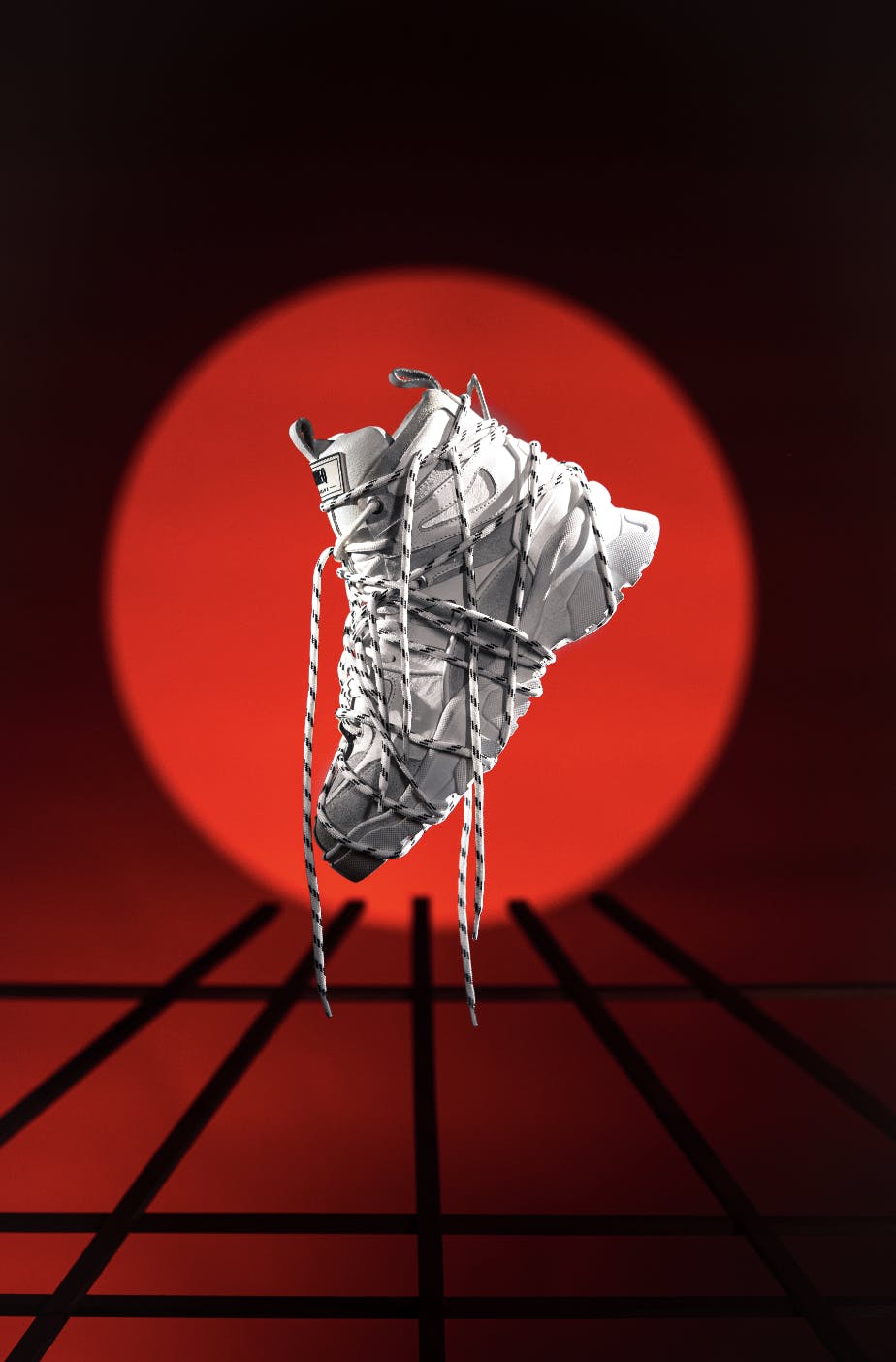 red spotlight behind white shoe