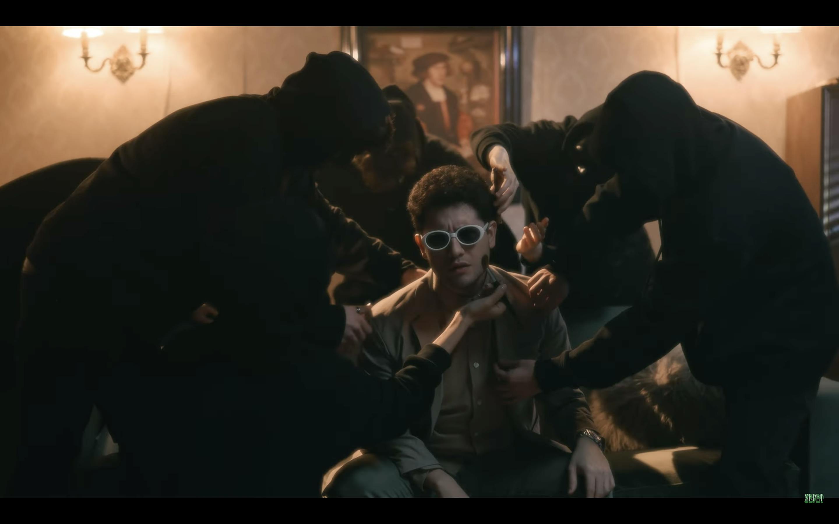 Man in sunglasses getting pampered by ninjas