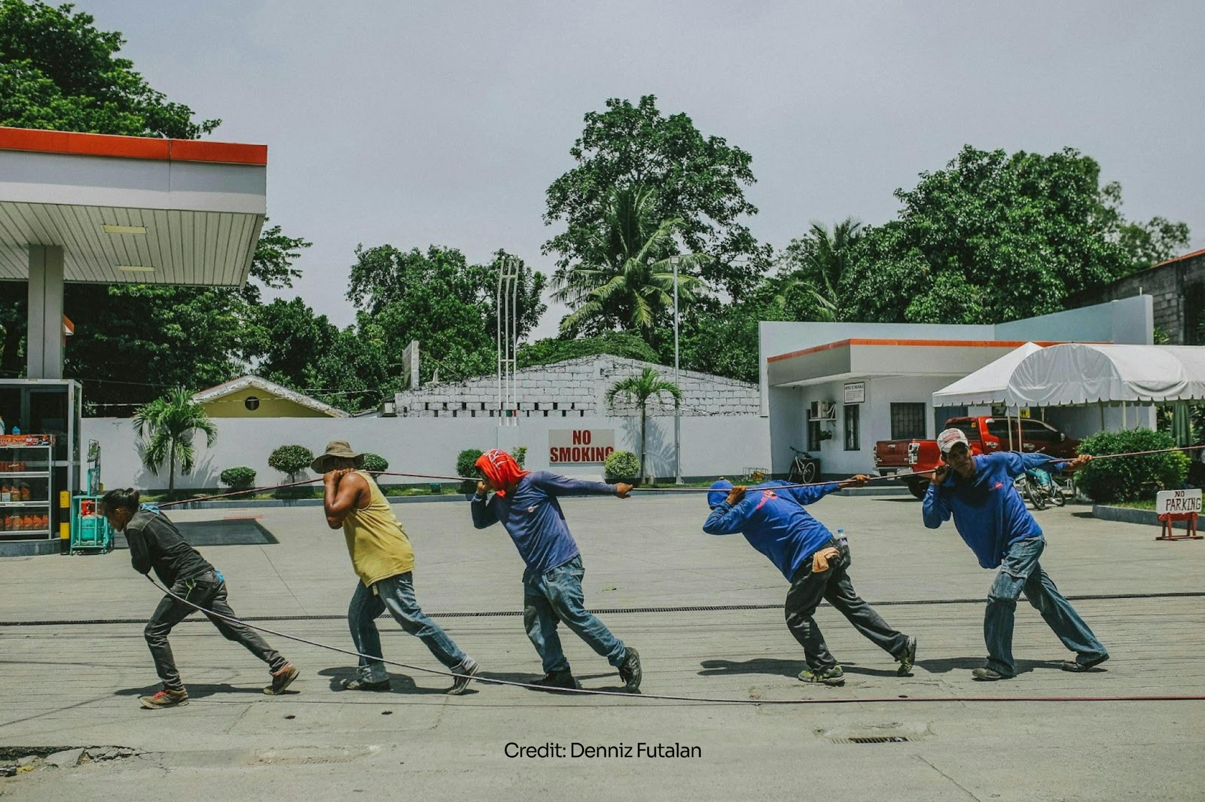 Men pulling a rope together