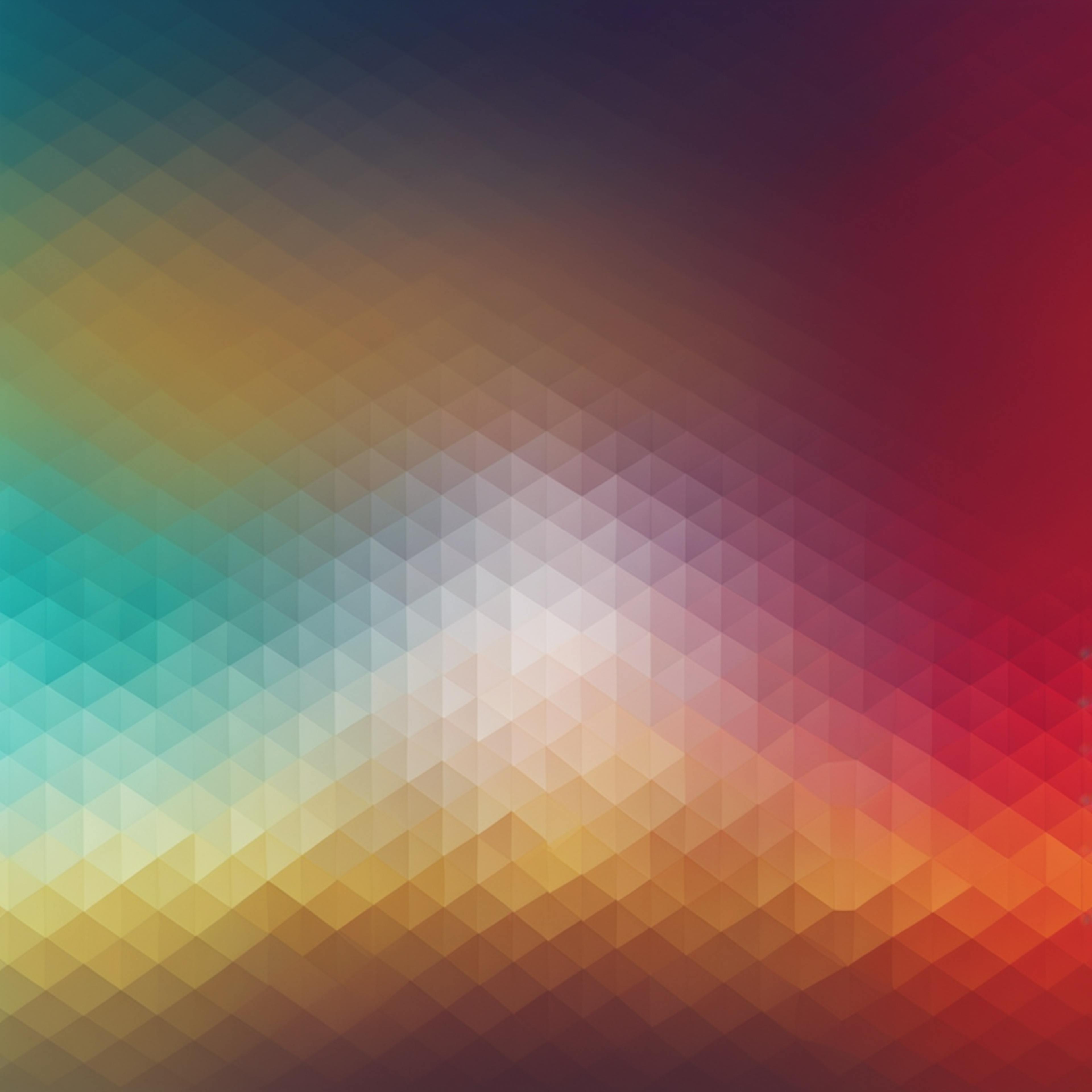 An intricate pattern of gradient colors transitioning from teal to orange, depicting the flexibility and customization of internet marketing packages.