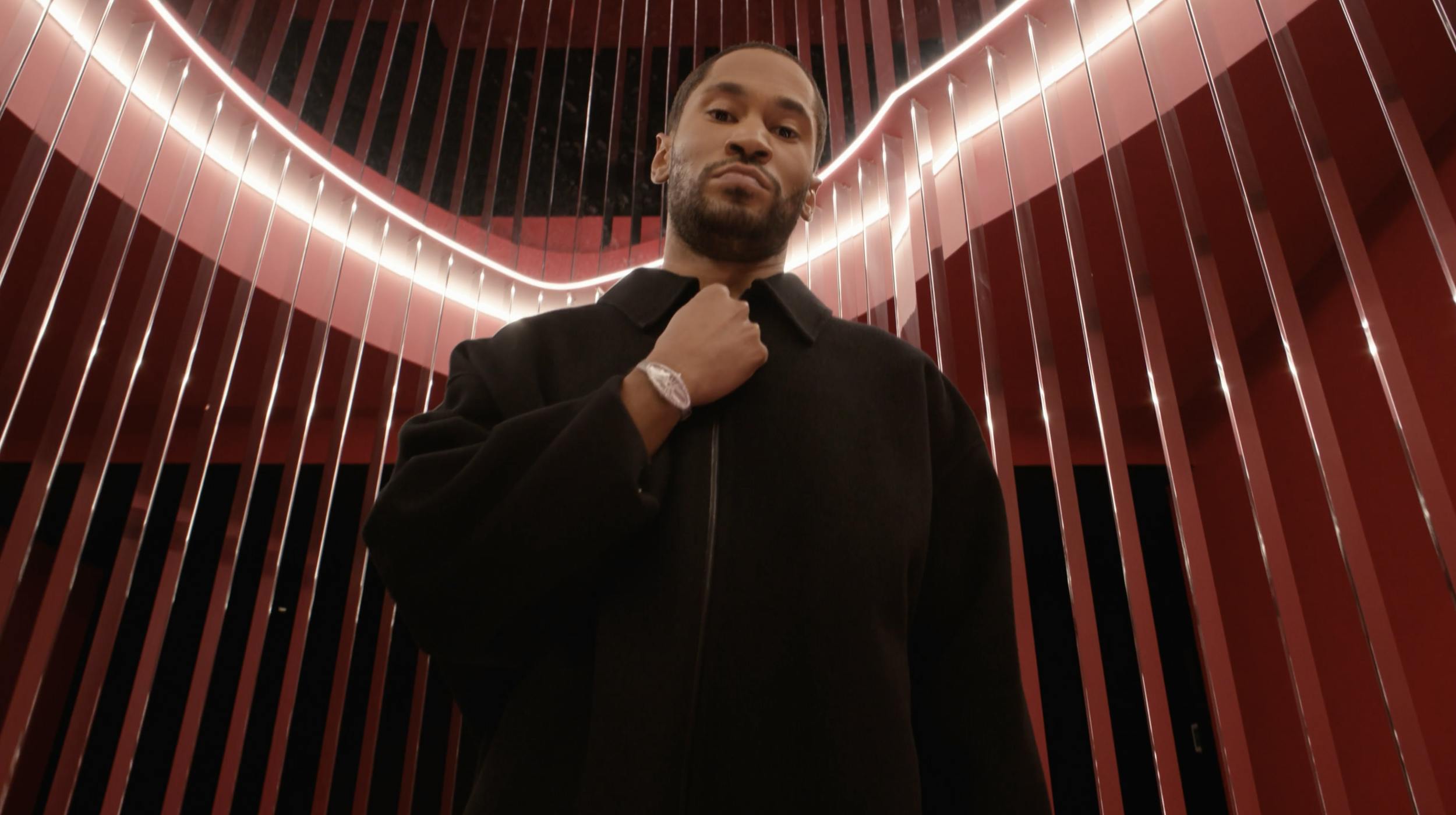 man adjusting his collar