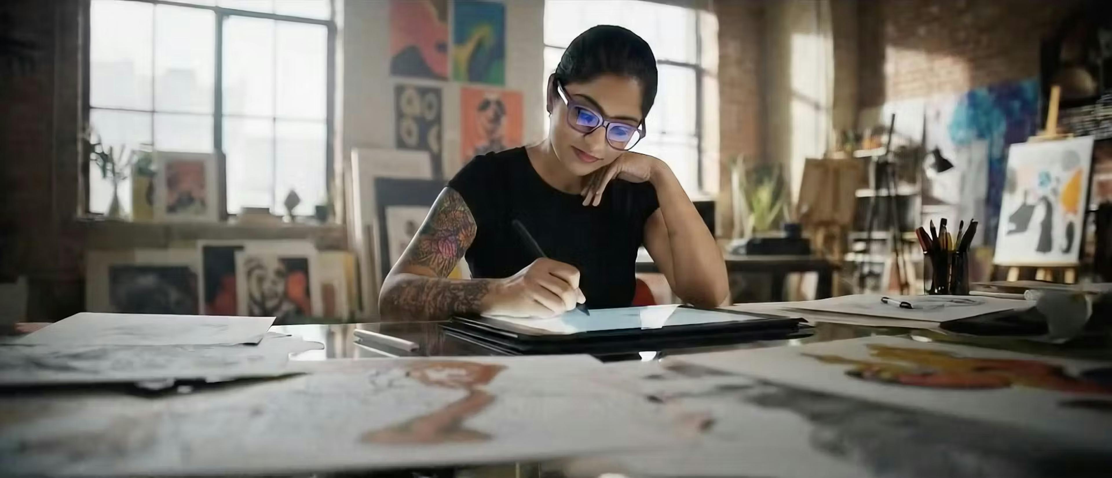 creative women drawing on an ipad