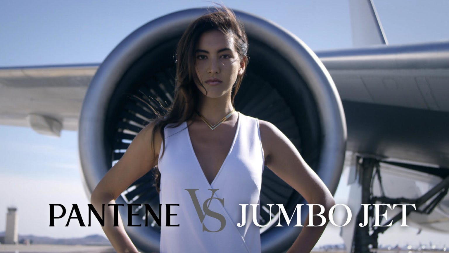 A woman in front of a jet turbine