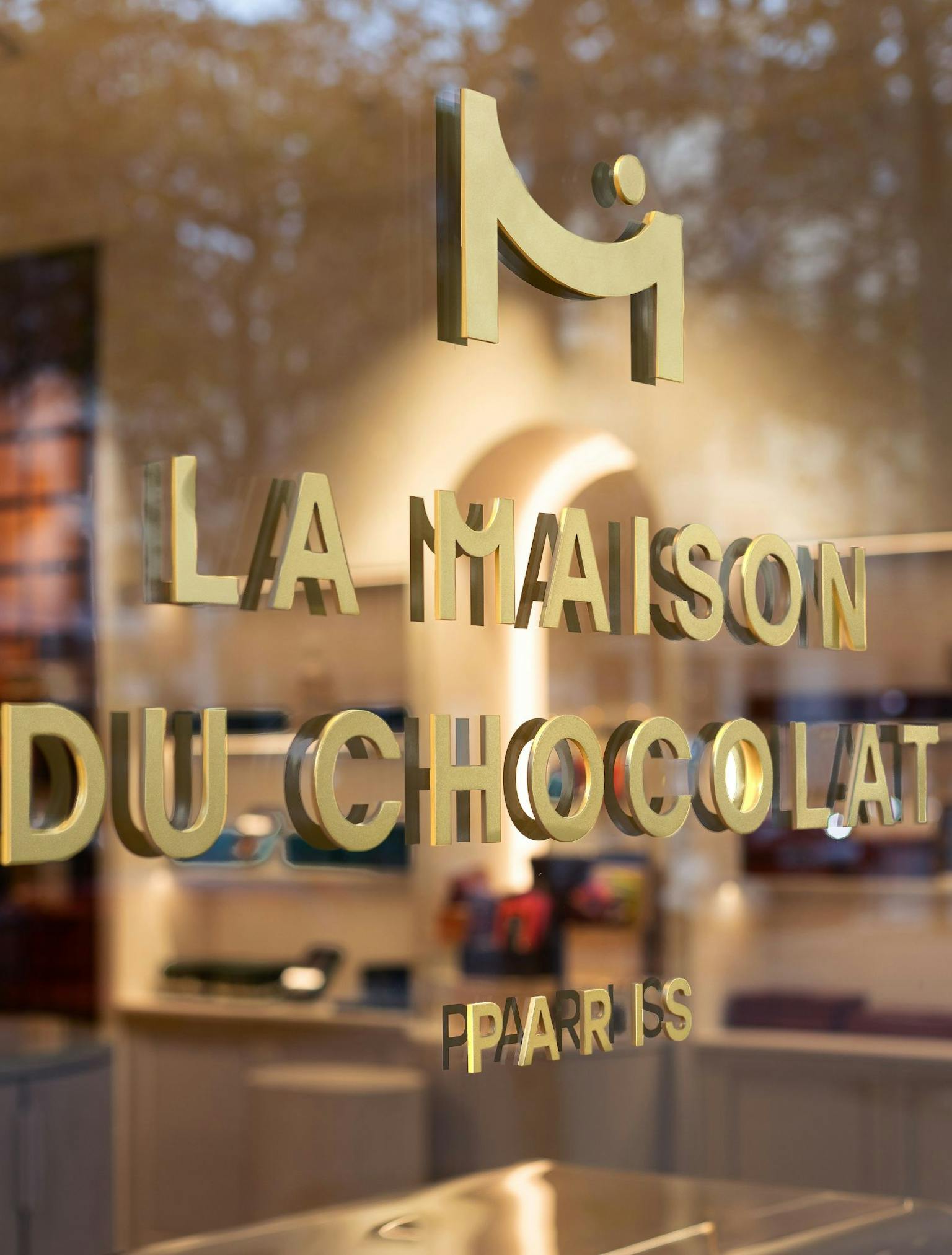 La Maison du Chocolat logo on a store window