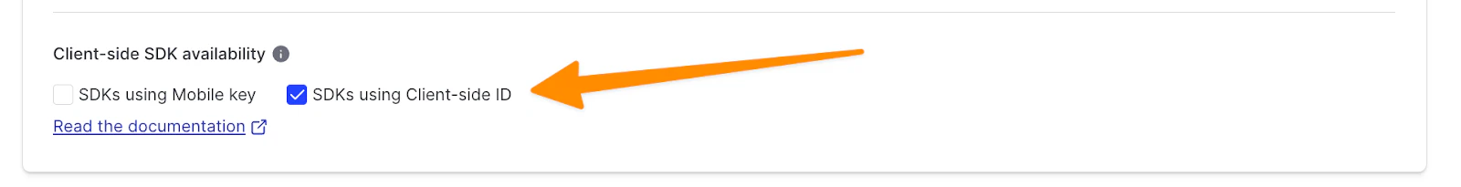 Client-side SDK availability configuration screen in LaunchDarkly, with an orange arrow pointing to a checkbox for SDKs using the client-side ID.