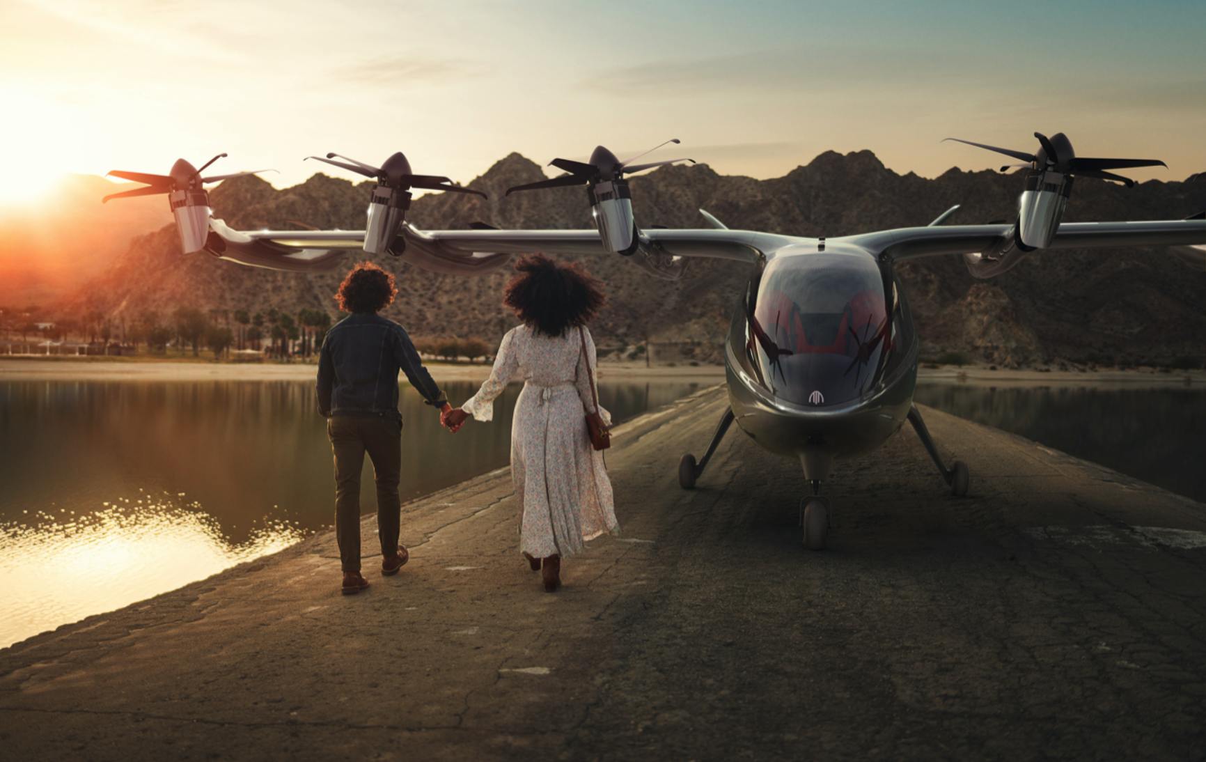 Couple walking towards Archer eVTOL aircraft for a trip