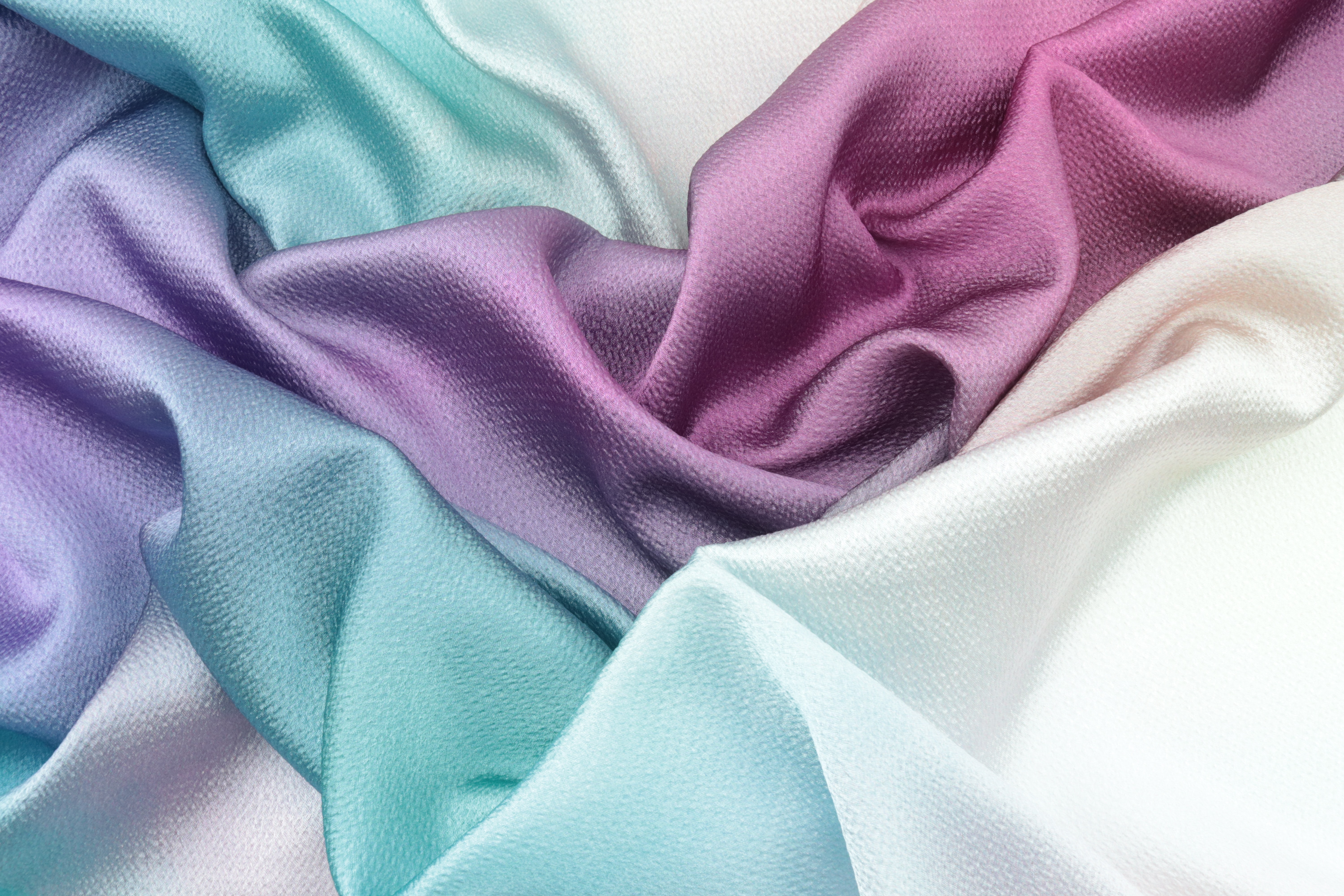 White, blue, and purple coloured silk