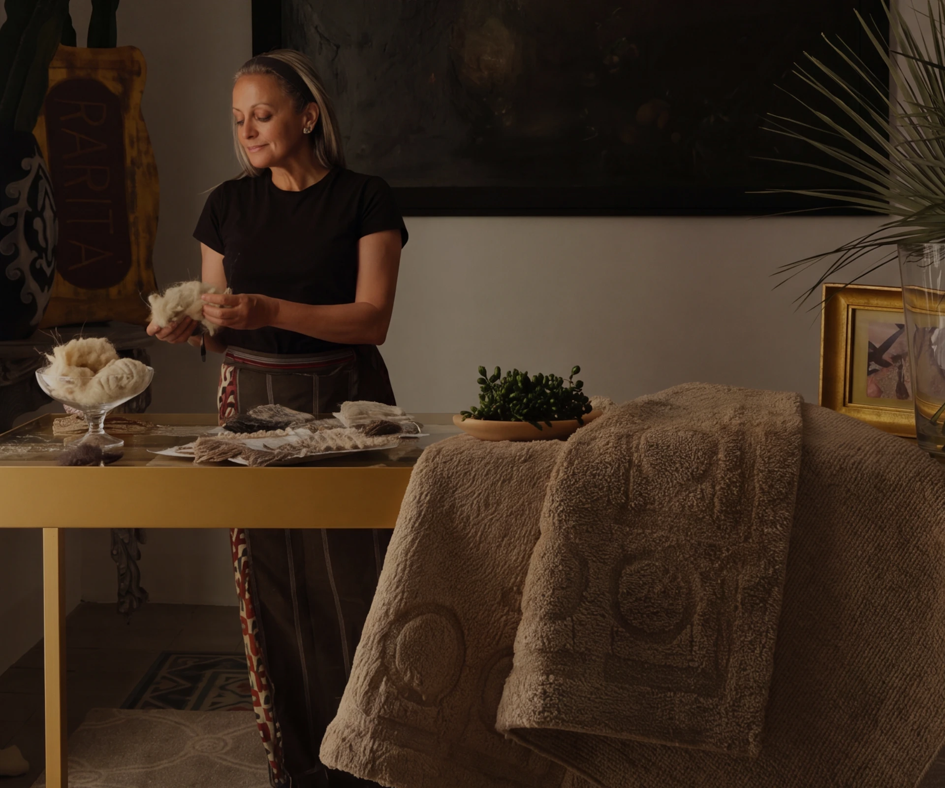 Mariella Ienna arranging textiles and yarns on a table