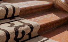Lavor Ombra rug draped over the stairs.