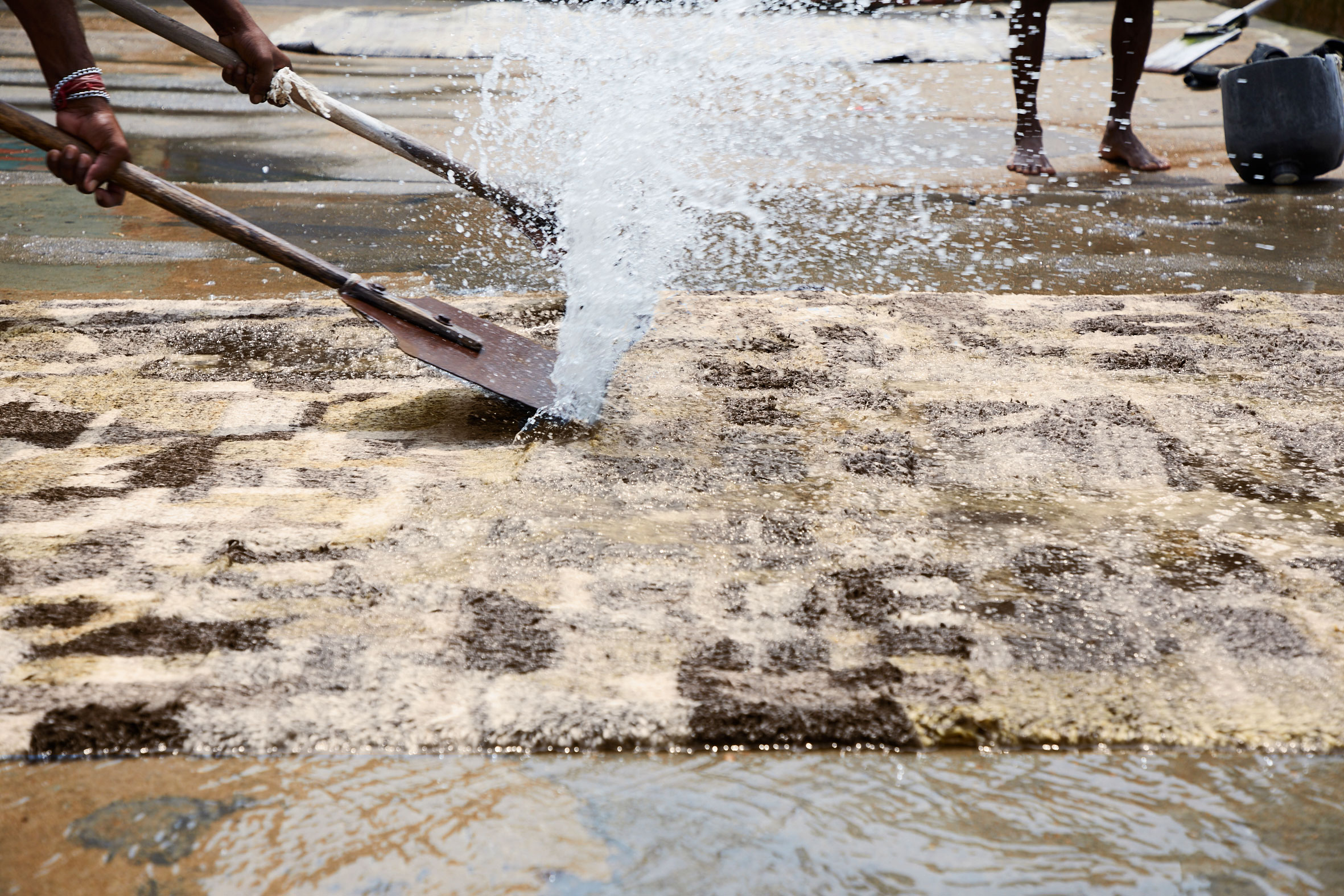 Artisans preparing a rug