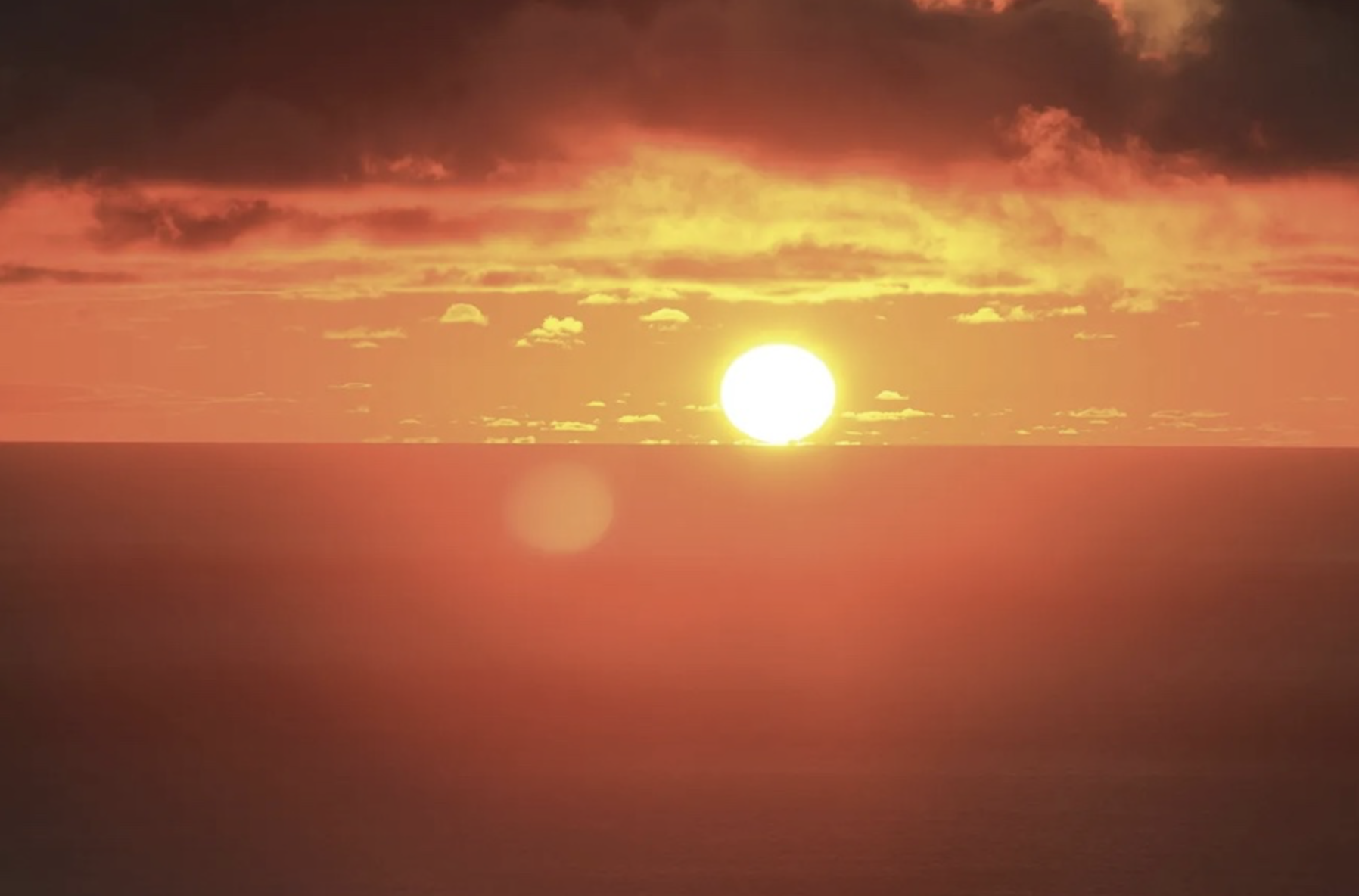 A deep orange summer sunset