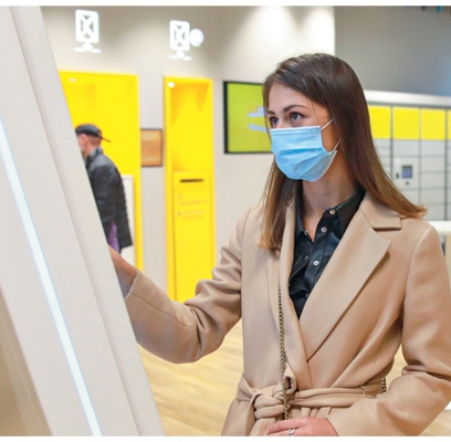 woman using screen in a post office