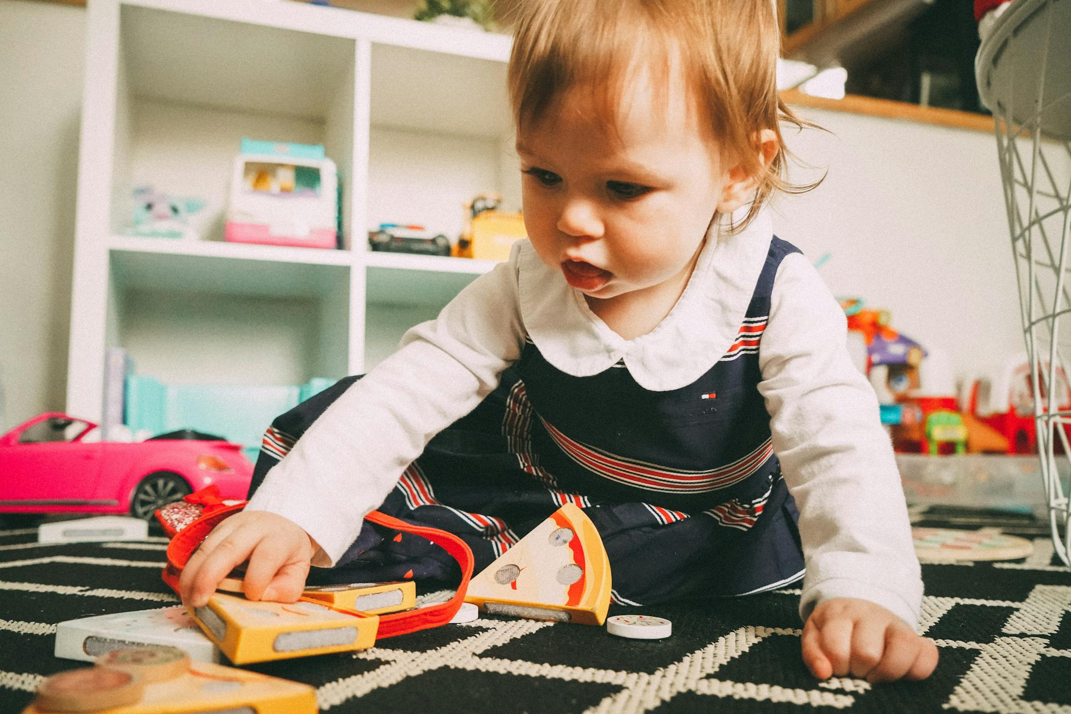 Toddler playing with toys