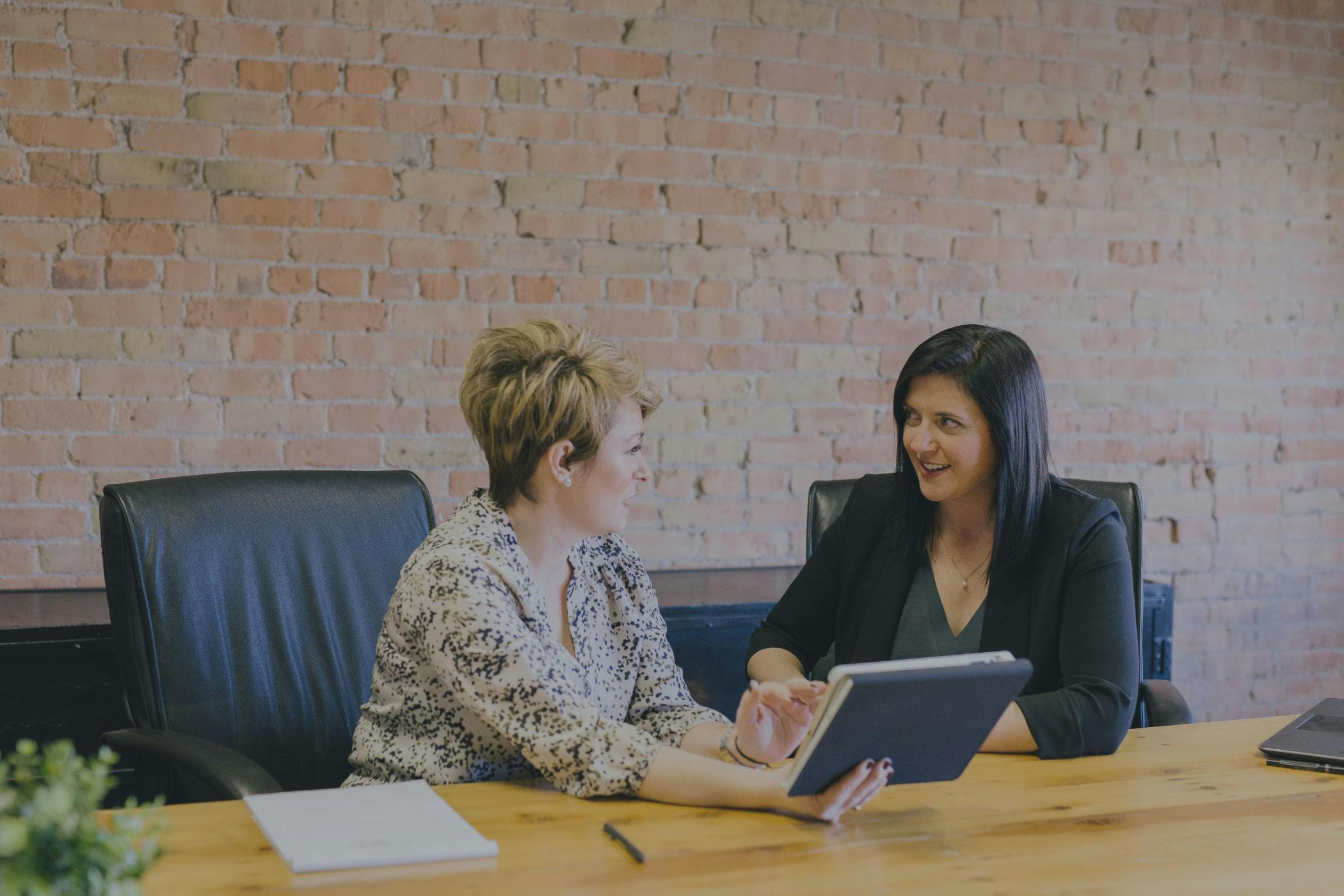 Two women working together in an office