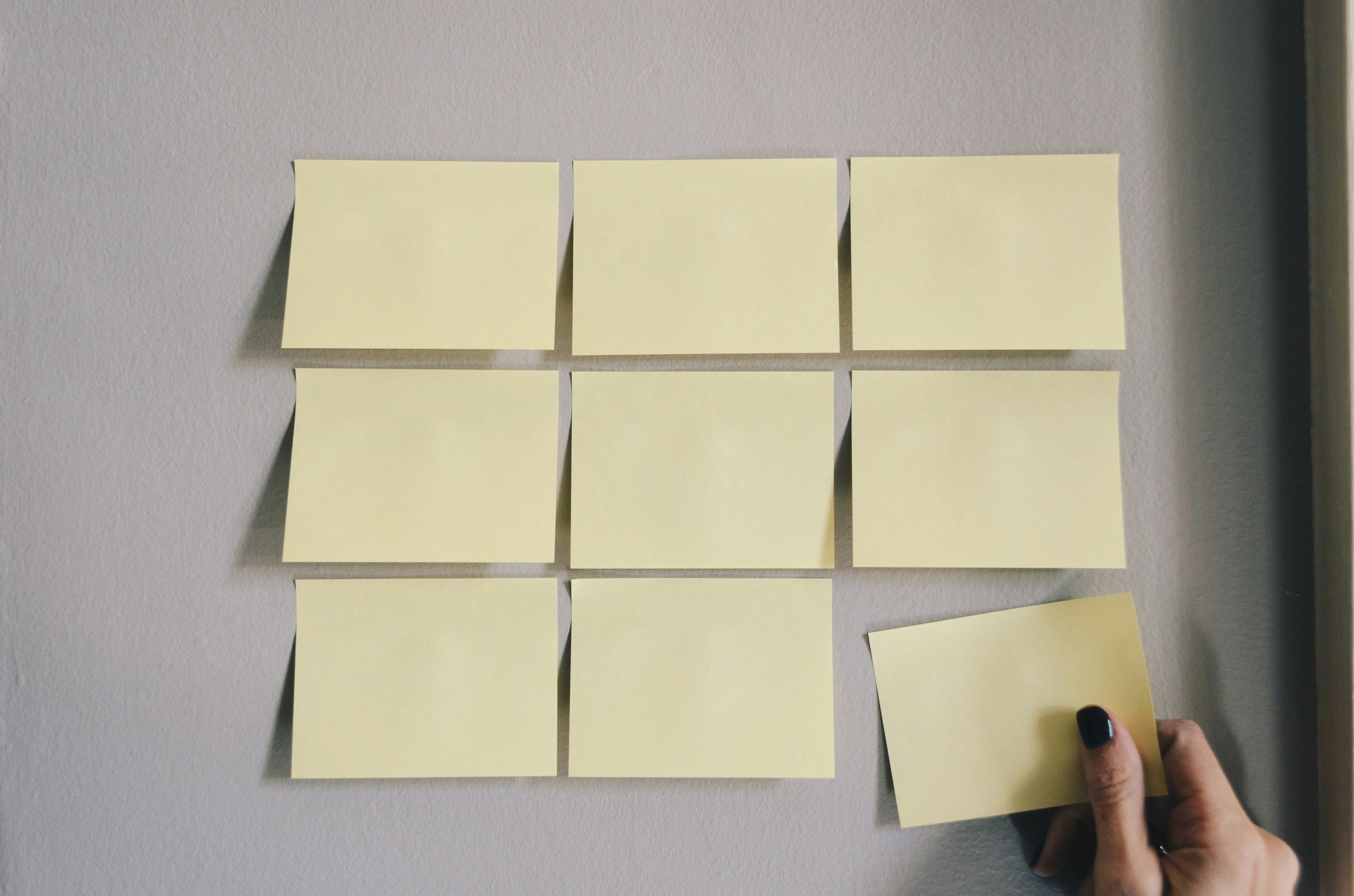 Blank post it notes arranged in a 3 by 3 grid