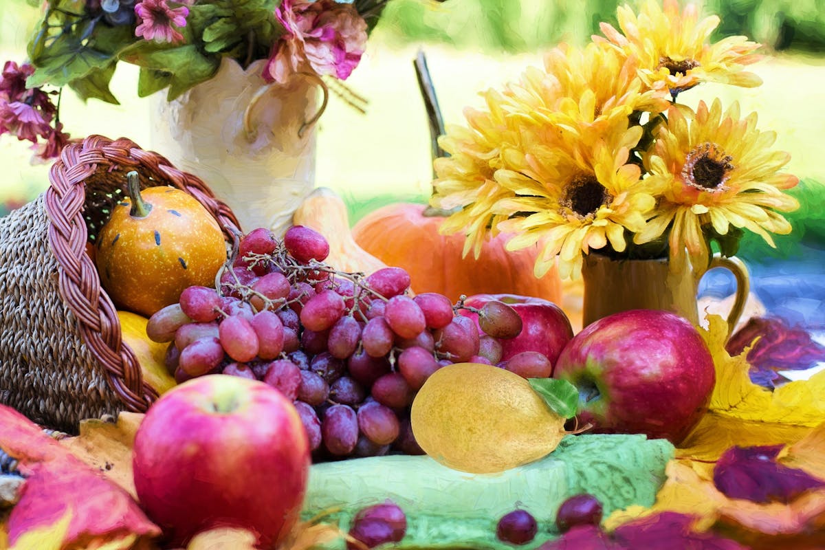 Photo of flowers and fruit on a table