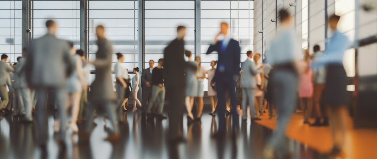 Group of busy people in a large shared space