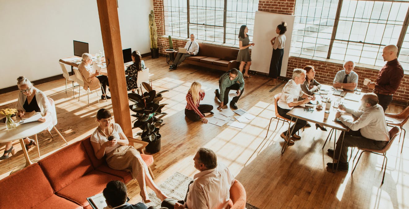 People talk in a coworking space.